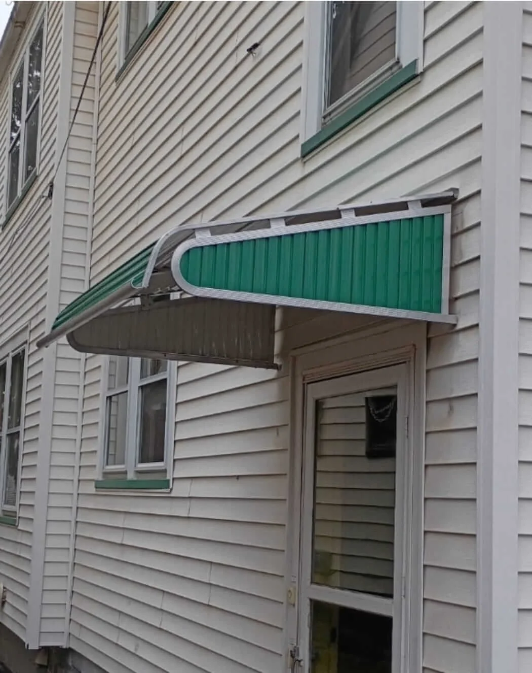 Residential entryway upgrade featuring a custom metal window awning installation by DLR Construction in Cuyahoga Falls, Ohio.