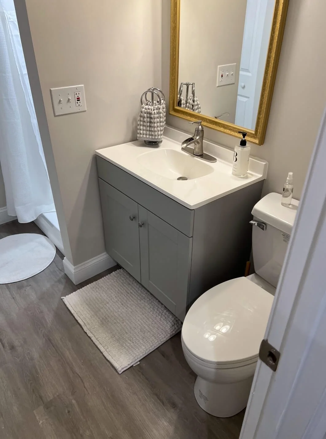 Basement bathroom, new construction. Including a shower, vanity, and up-flush toilet, by DLR Construction in Canton, Ohio.