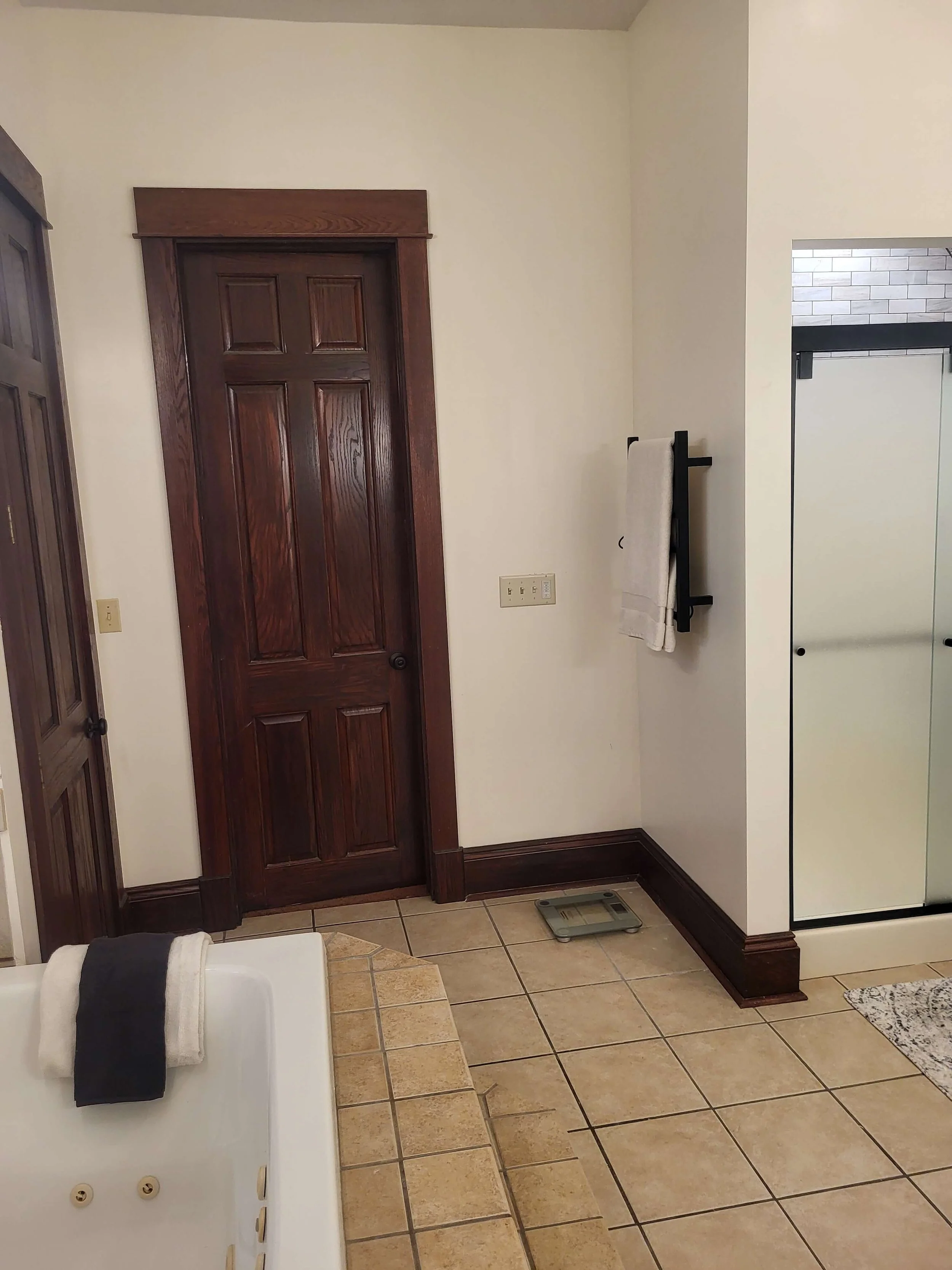 Entry view of remodeled bathroom with tile flooring and updated layout