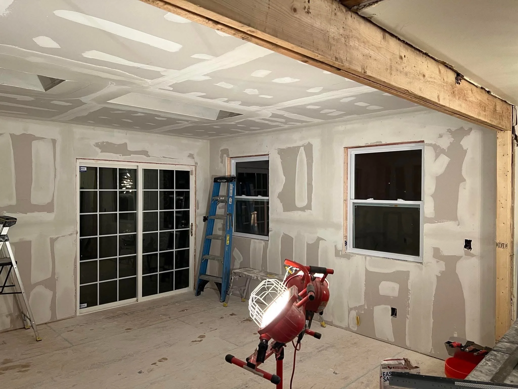 Mudding Stage in New kitchen Addition. Window and Sliding Door Installment.