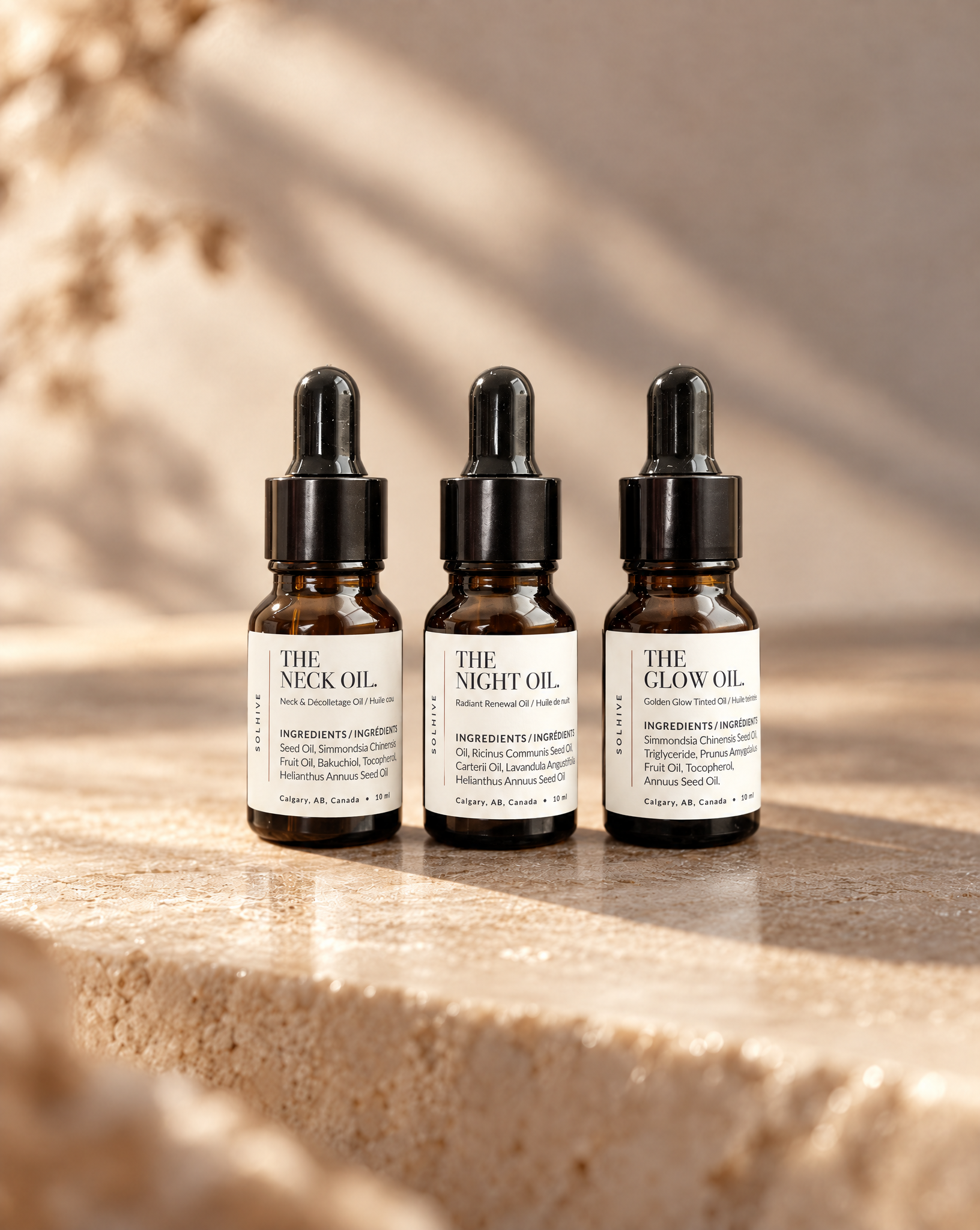 The Face Oil Trio on Stone.png