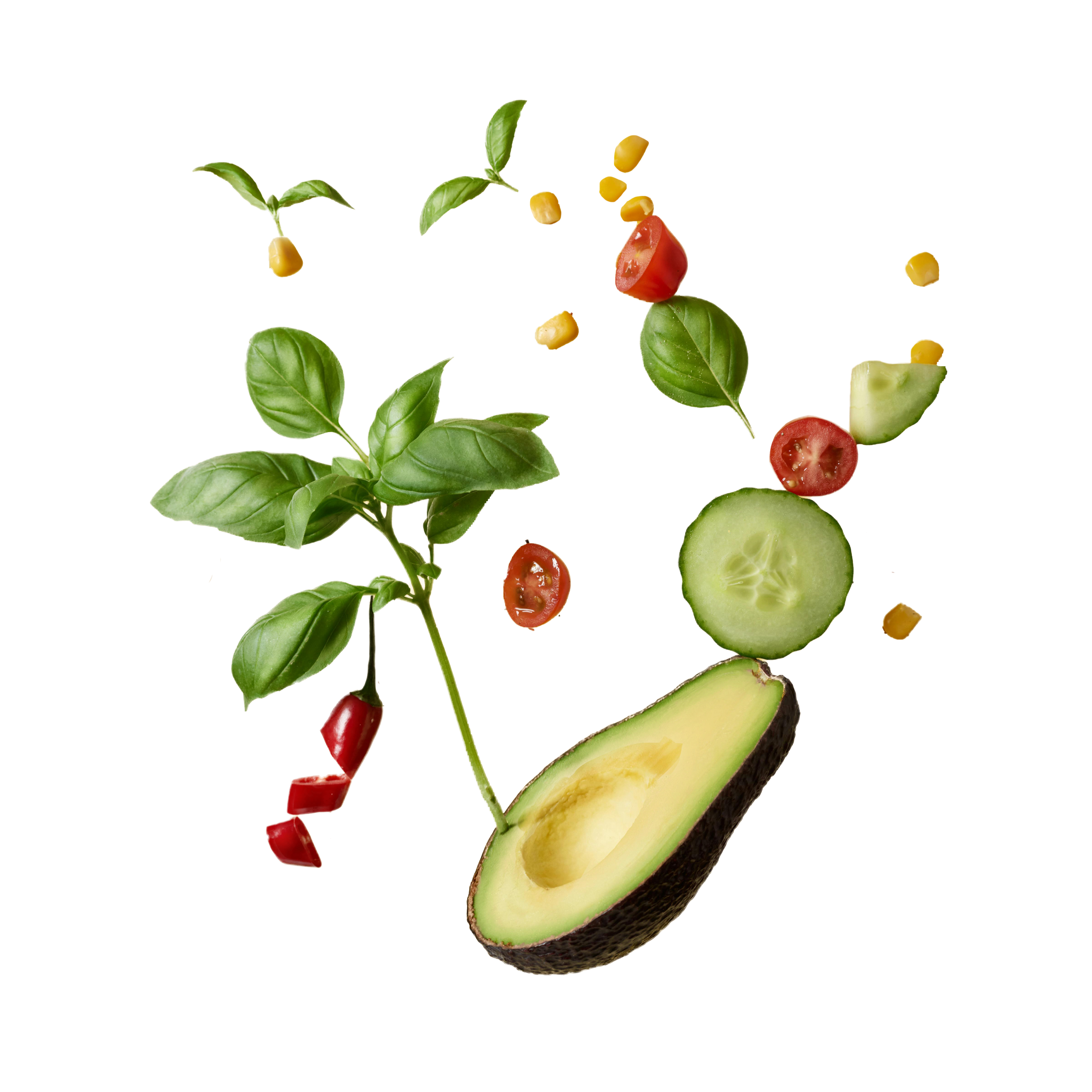 A halved avocado, cherry tomatoes, cucumber slices, corn kernels, and fresh basil leaves arranged against a black background.
