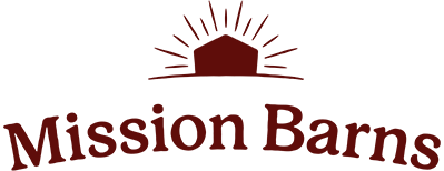Logo of Mission Barns featuring a sun rising over a barn
