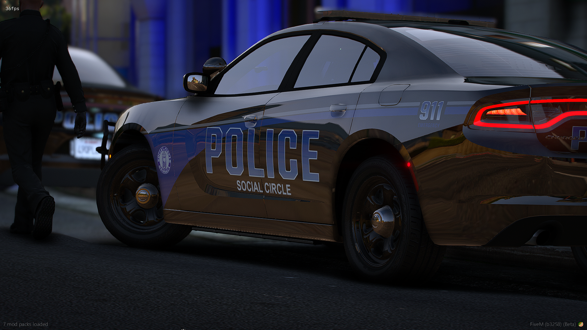 Police car with Social Circle police markings parked on street at dusk with officer walking away in the background.