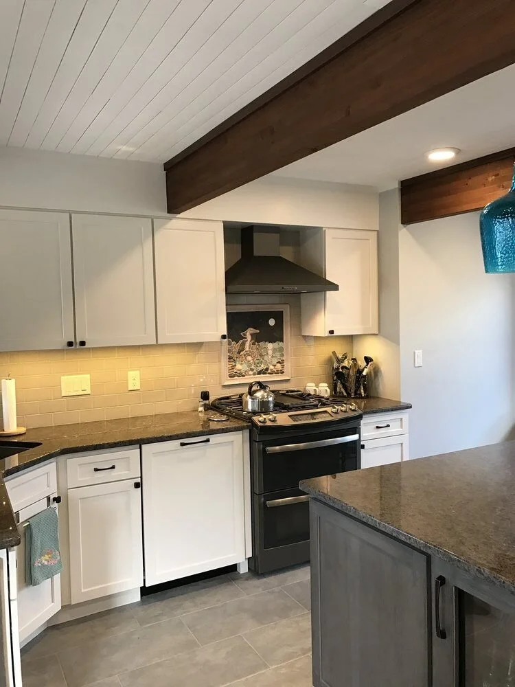 Updated kitchen with white cabinets and granite counters in Mashpee by At Design Remodel.jpg