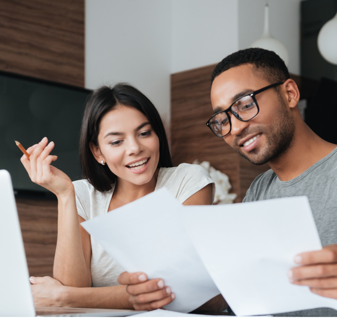 A woman and a man sitting at a table ,practice management consulting support for healthcare offices with Forward Revenue Management
