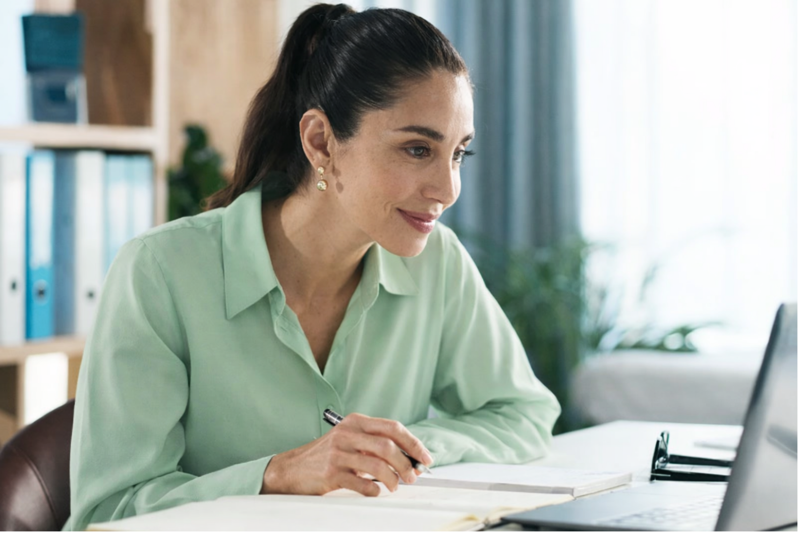 A woman with dark hair in a ponytail, chiropractic practice operations and billing assistance team with Forward Revenue Management