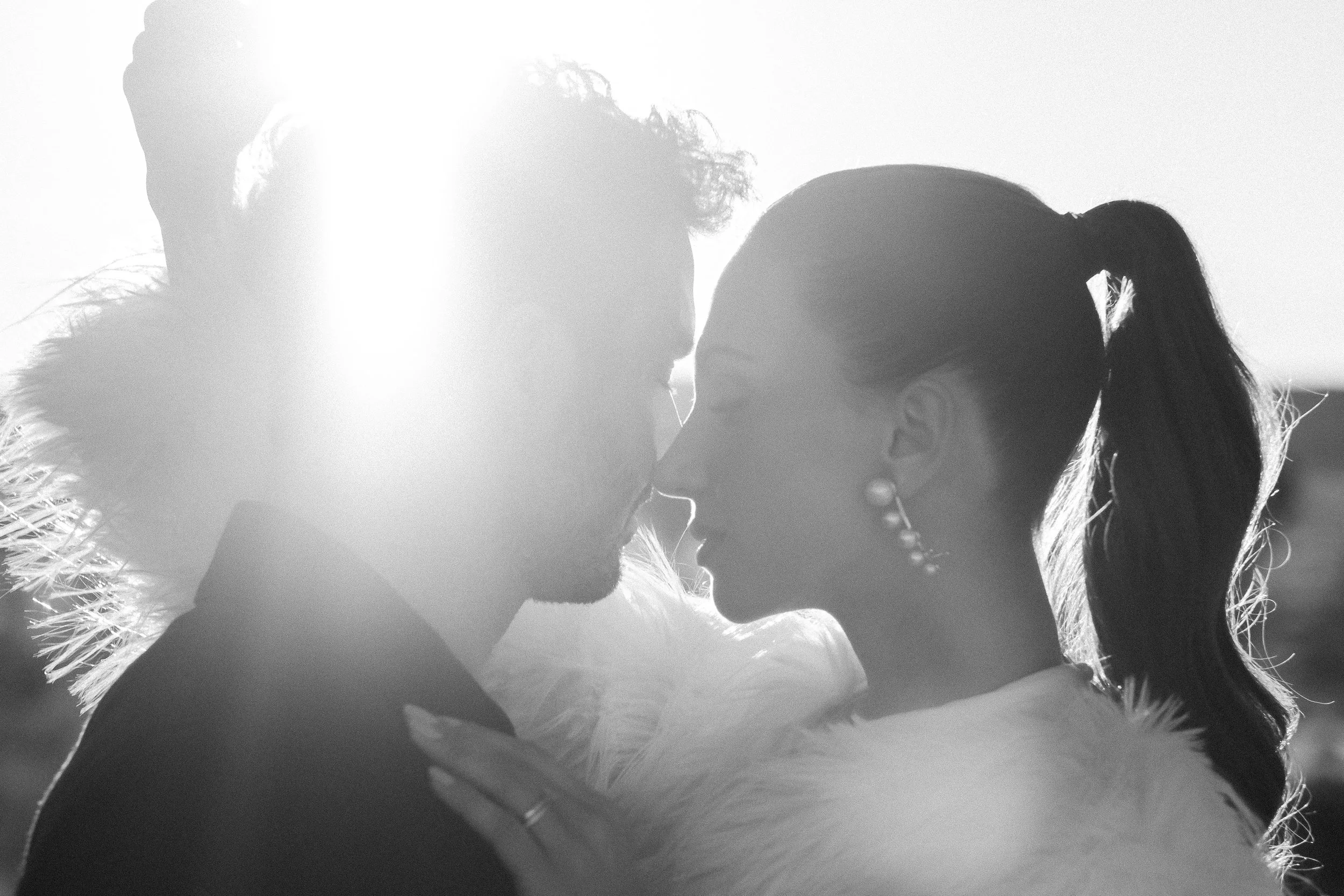 Black and white portrait of a couple sharing a quiet moment in Joshua Tree during a desert wedding styled shoot.