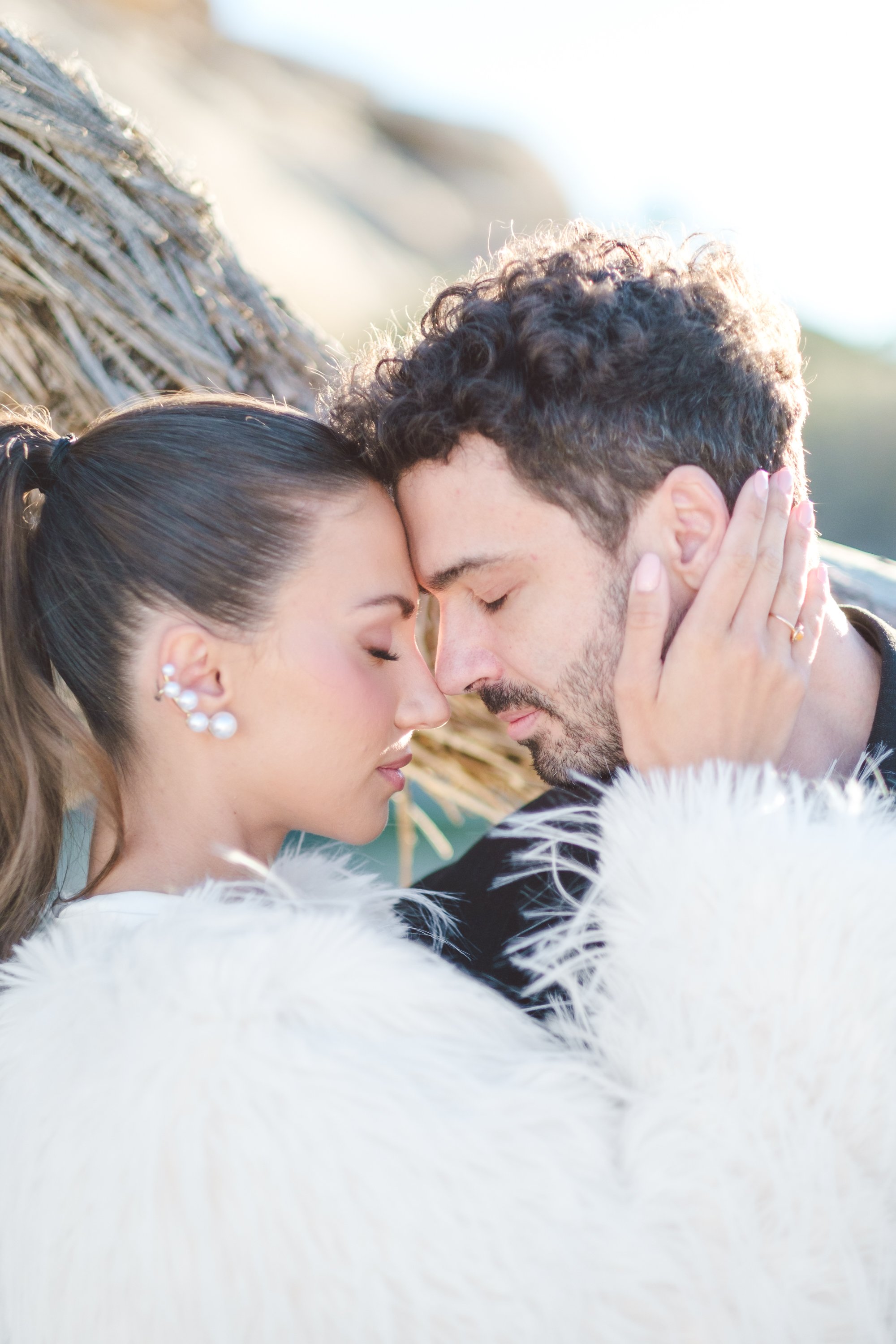 Intimate close up of the couple framed by desert light and soft shadows during a Joshua Tree wedding styled shoot.