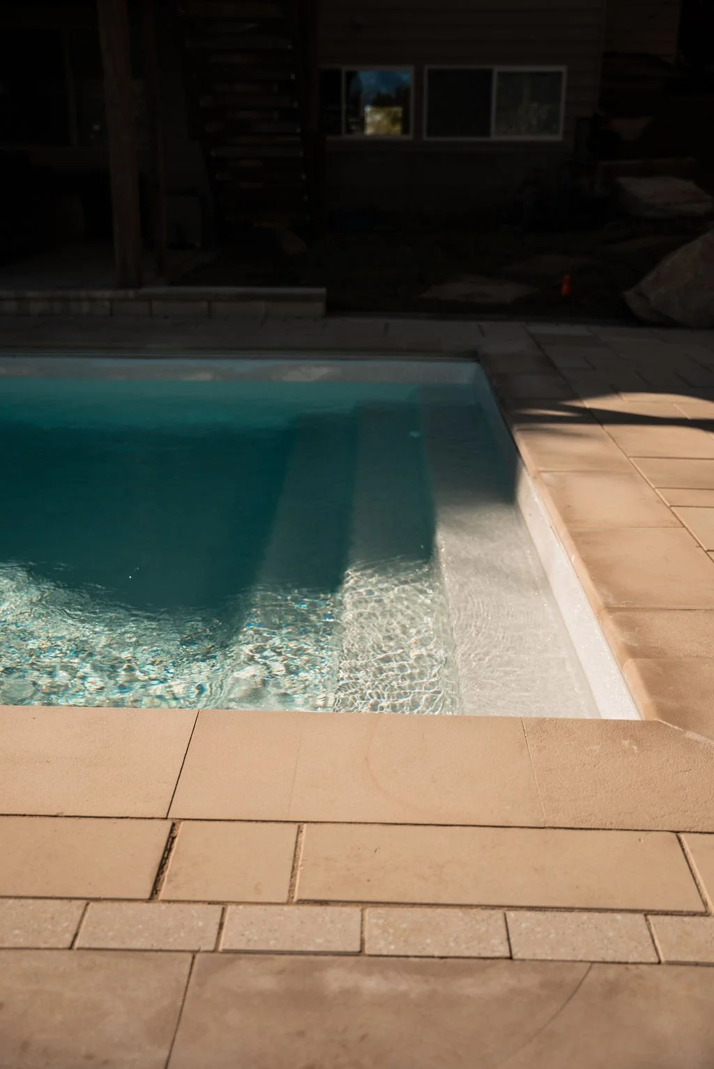Steps into a custom Latham fiberglass pool