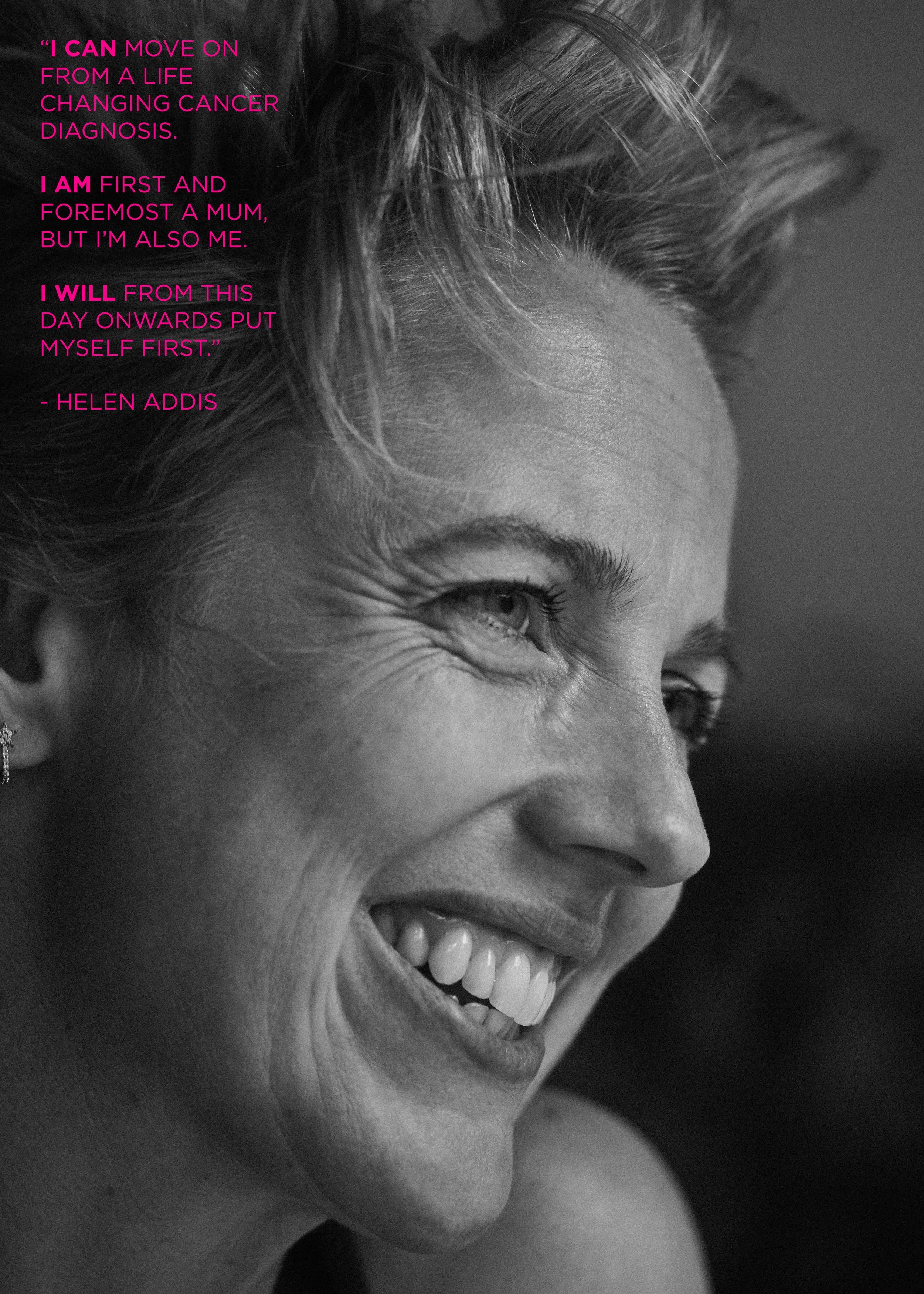 Black and white close-up portrait of a smiling woman with short, styled hair and visible wrinkles around her eye.