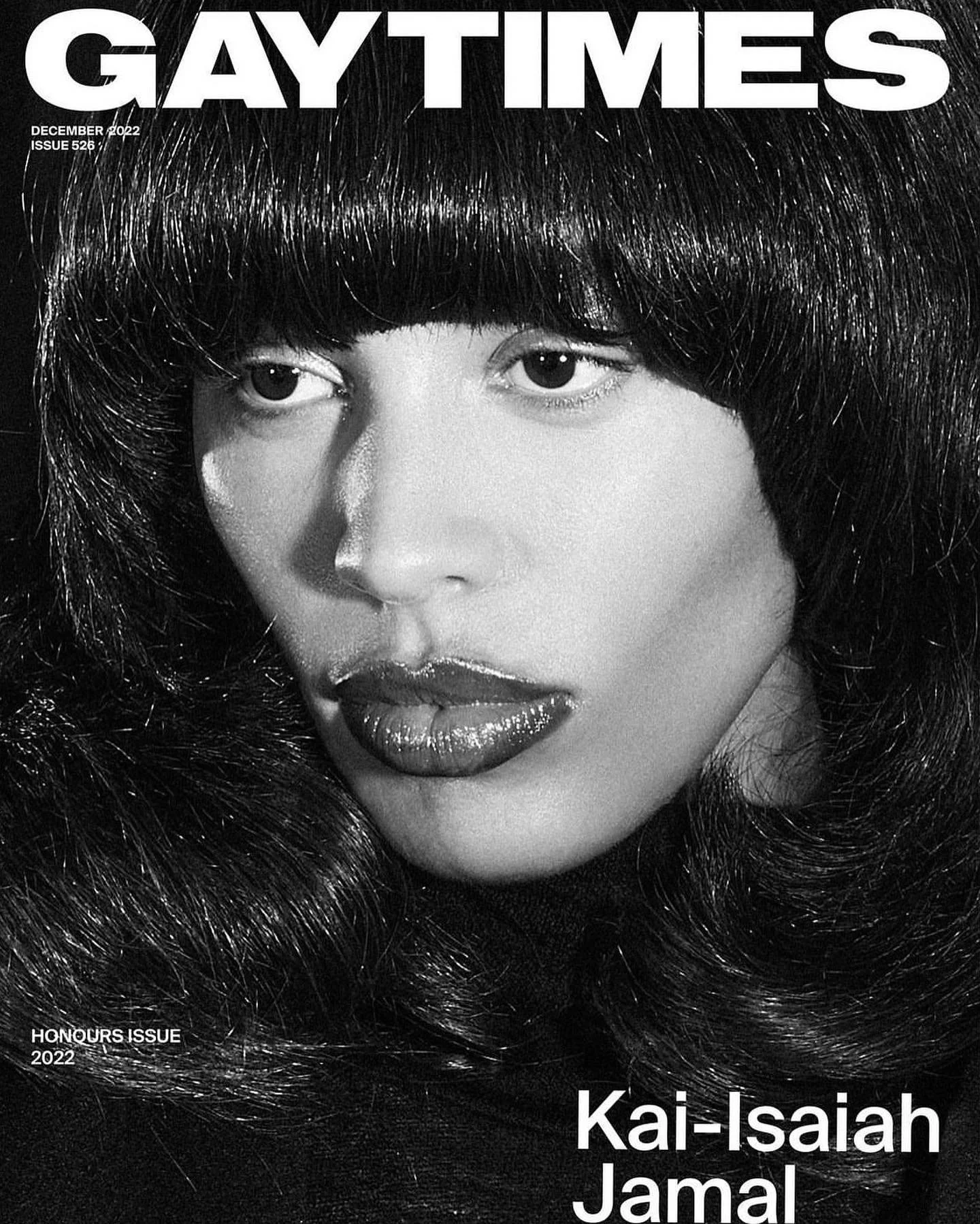 Cover of Gay Times magazine featuring Kai-Isaiah Jamal with long dark hair and glossy lips, black and white photograph, December 2022, Honours Issue.