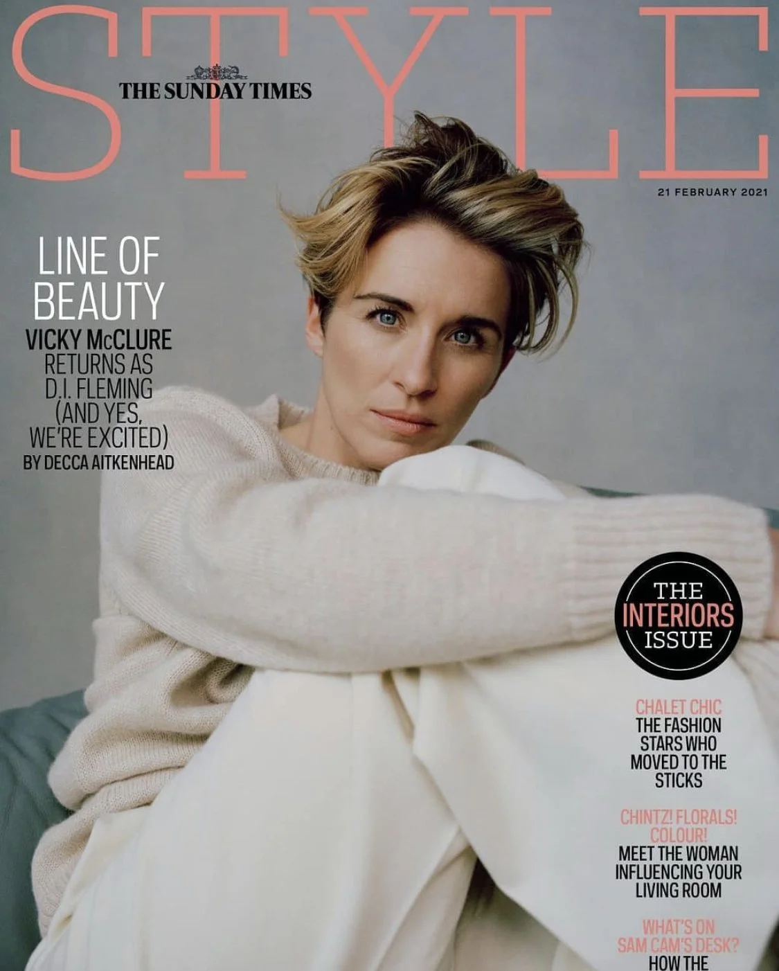 Cover of Style Magazine featuring a woman with short, styled hair, wearing a cream sweater and sitting on white furniture. The cover includes headlines about beauty, interior design, fashion, flowers, and decor.