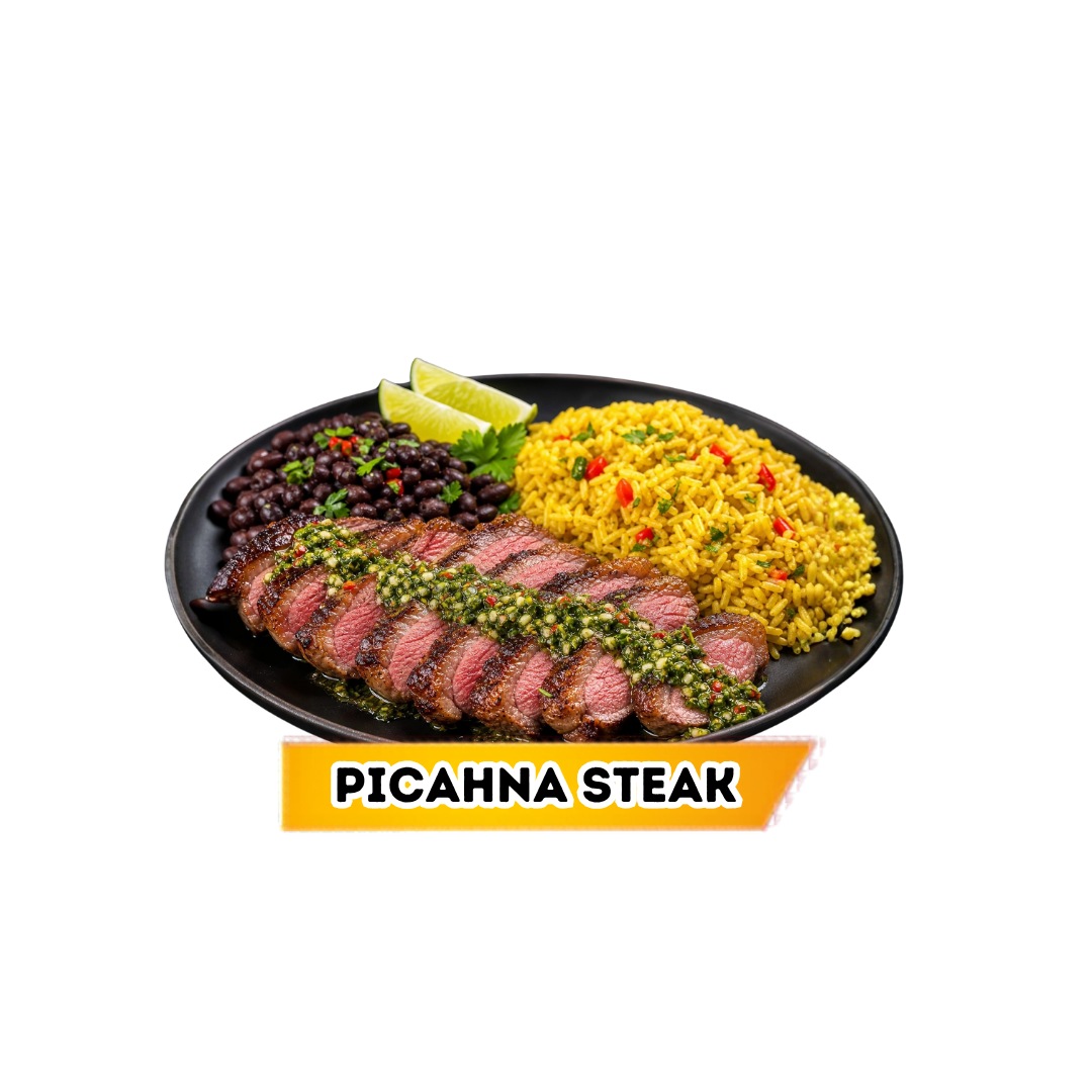 Plate of sliced picanha steak topped with chimichurri sauce, served with black beans, seasoned yellow rice with red and green peppers, and lime wedges.