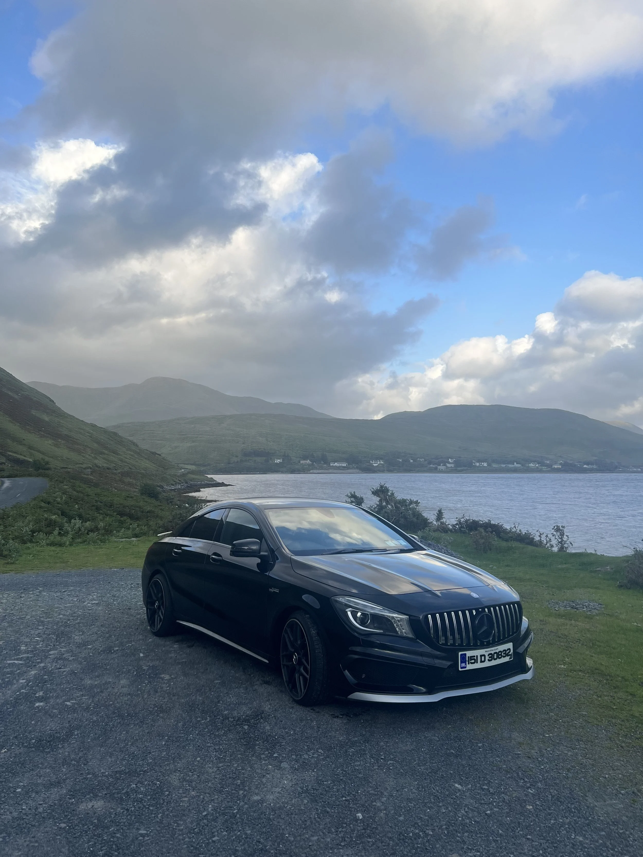Styled Mercedes parked by the coast in Ireland