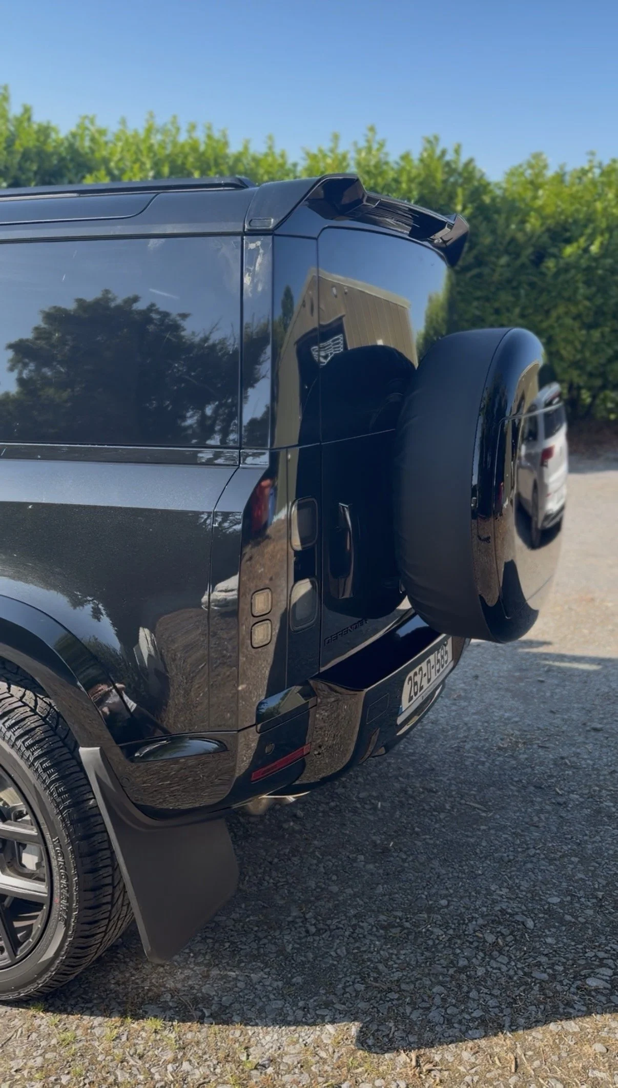 Land Rover Defender 90 rear with gloss black spoiler and spare wheel cover fitted