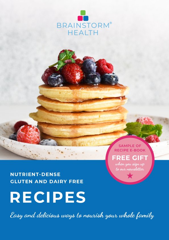 Cover of a nutrition recipe book featuring a stack of pancakes topped with mixed berries and mint, with a logo for Brainstorm Health at the top and a pink circle indicating a free gift for signing up to the newsletter.