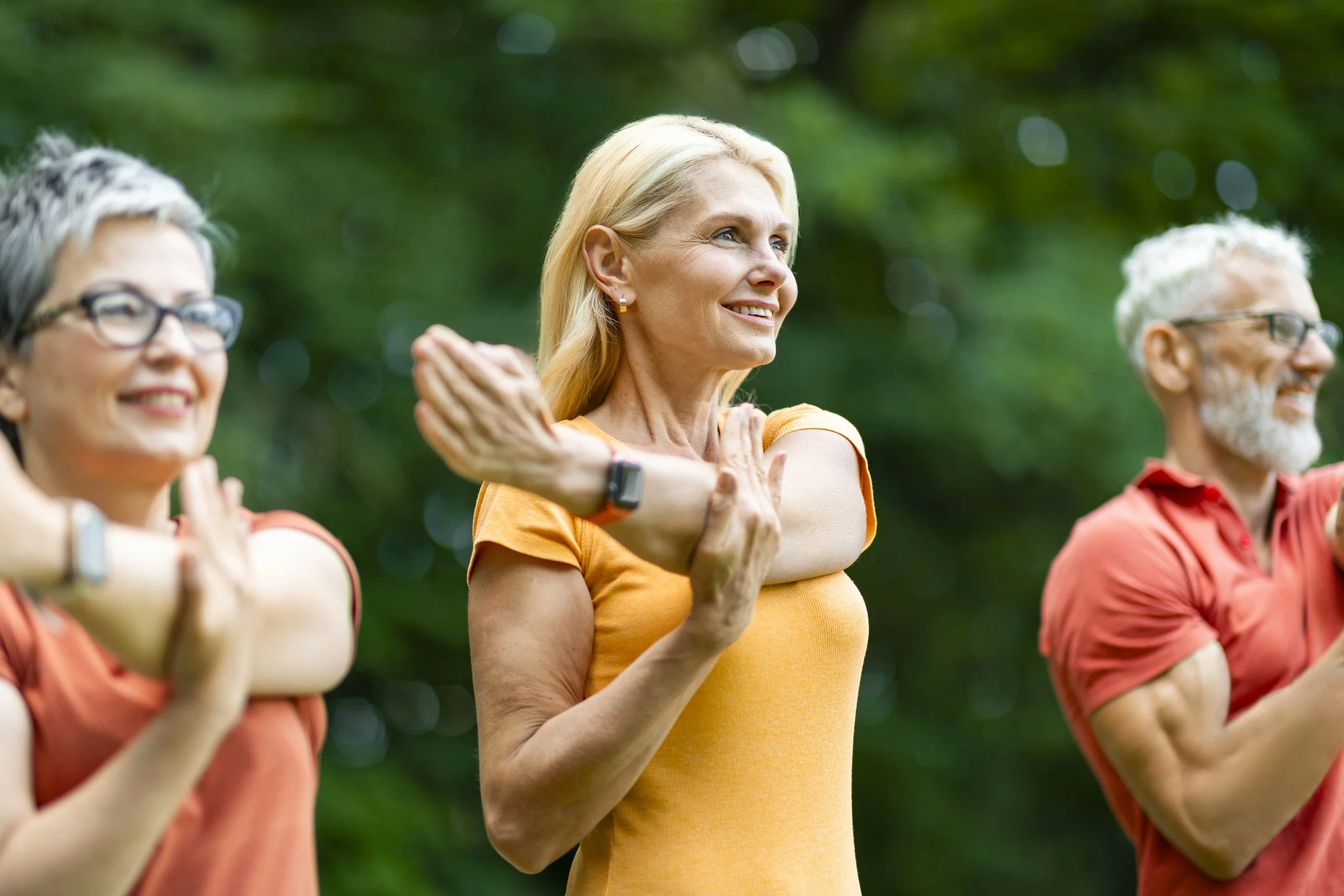 group-happy-senior-people-training-outdoors-stretching-arm-muscles.jpg