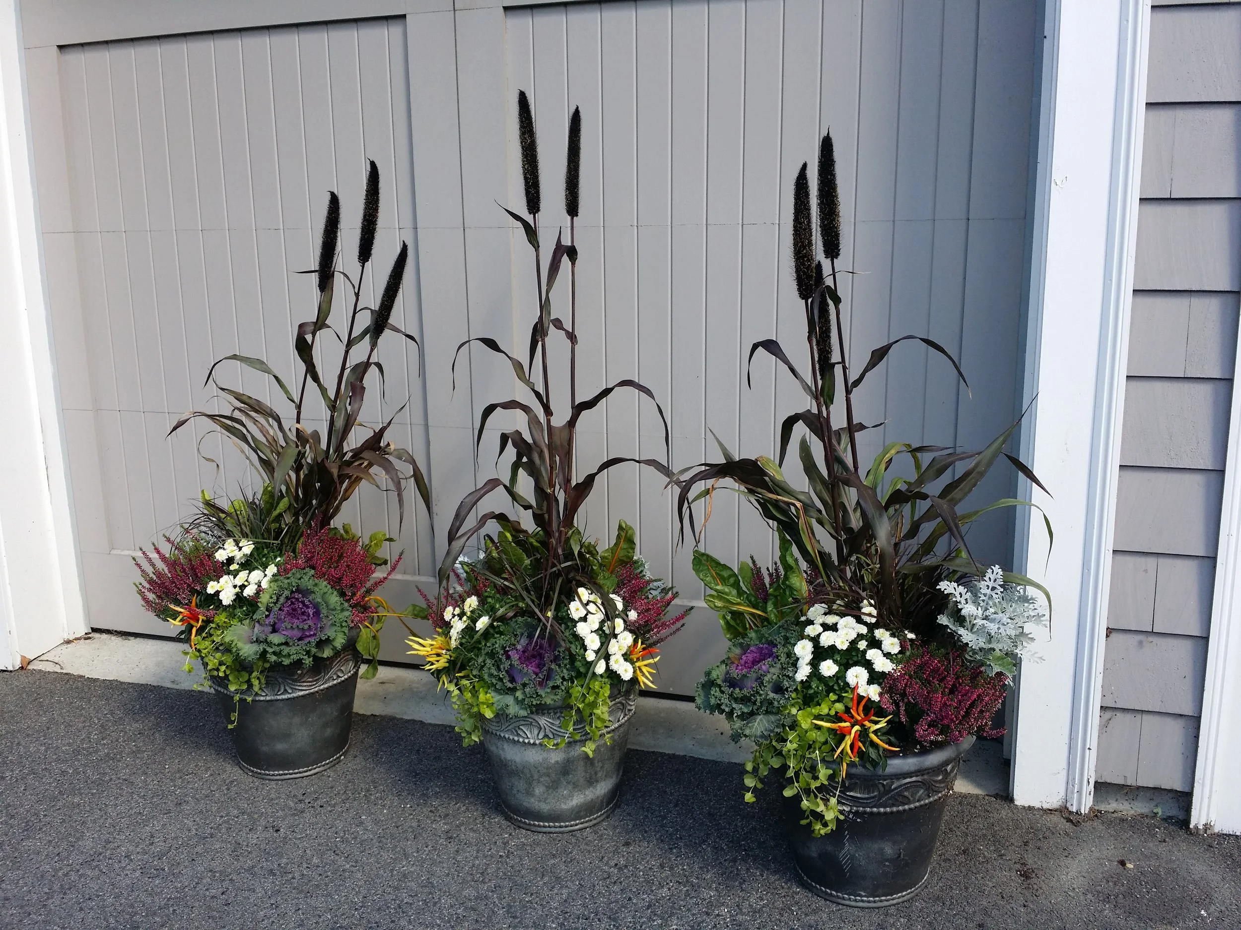 From cattails to mums, this trio of planters adds color and warmth to any garage space.
