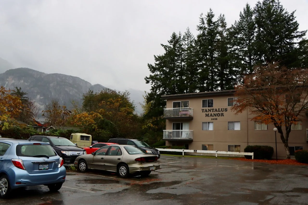 Affordable housing buildings at Tantalus in Squamish before retrofit work begins. NDY Contracting supporting energy efficiency and housing longevity.