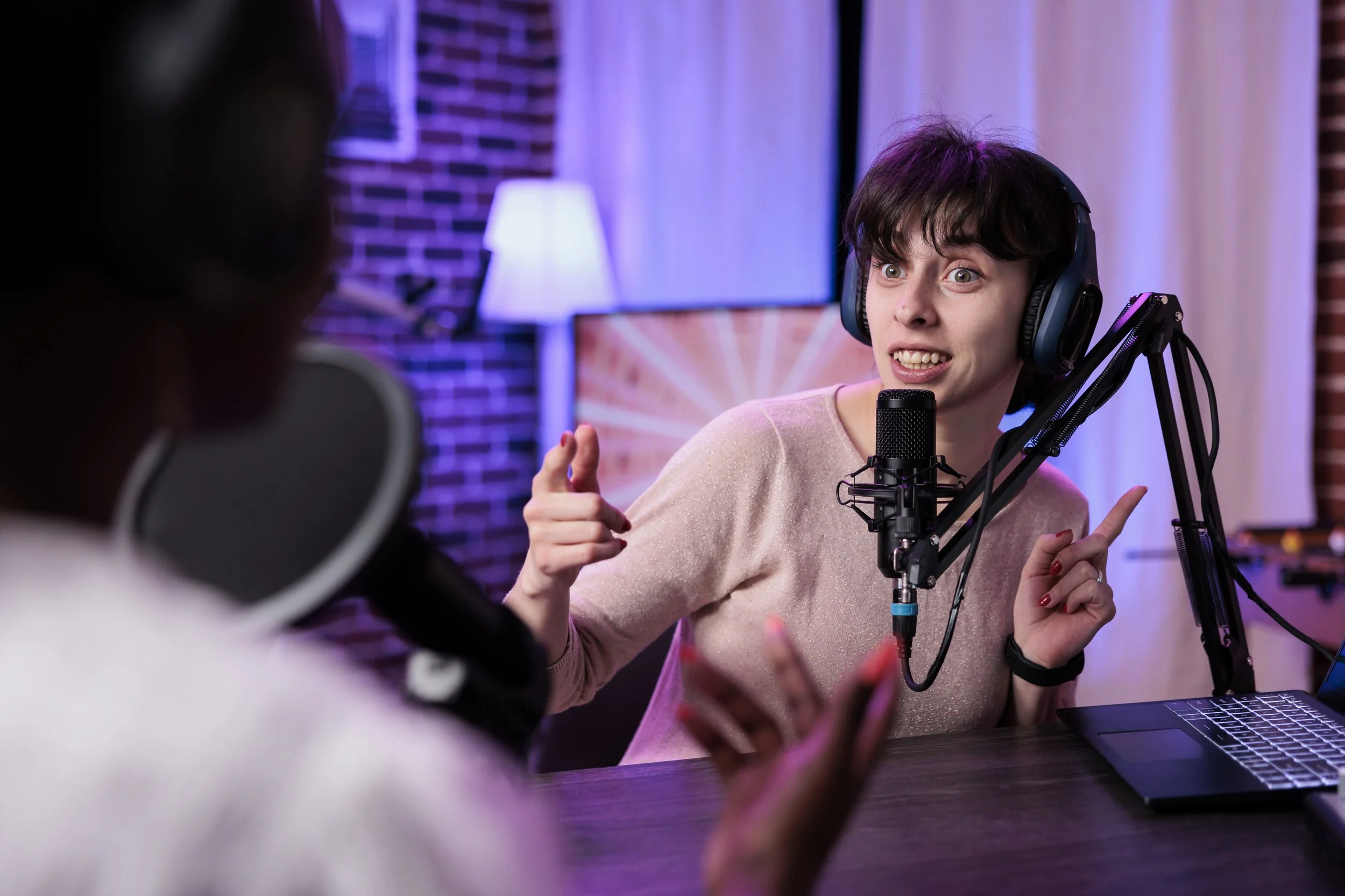 female-presenter-interviewing-young-woman-with-podcast-equipment-having-conversation-broadcast-live-channel-women-meeting-studio-record-discussion-social-media.jpg