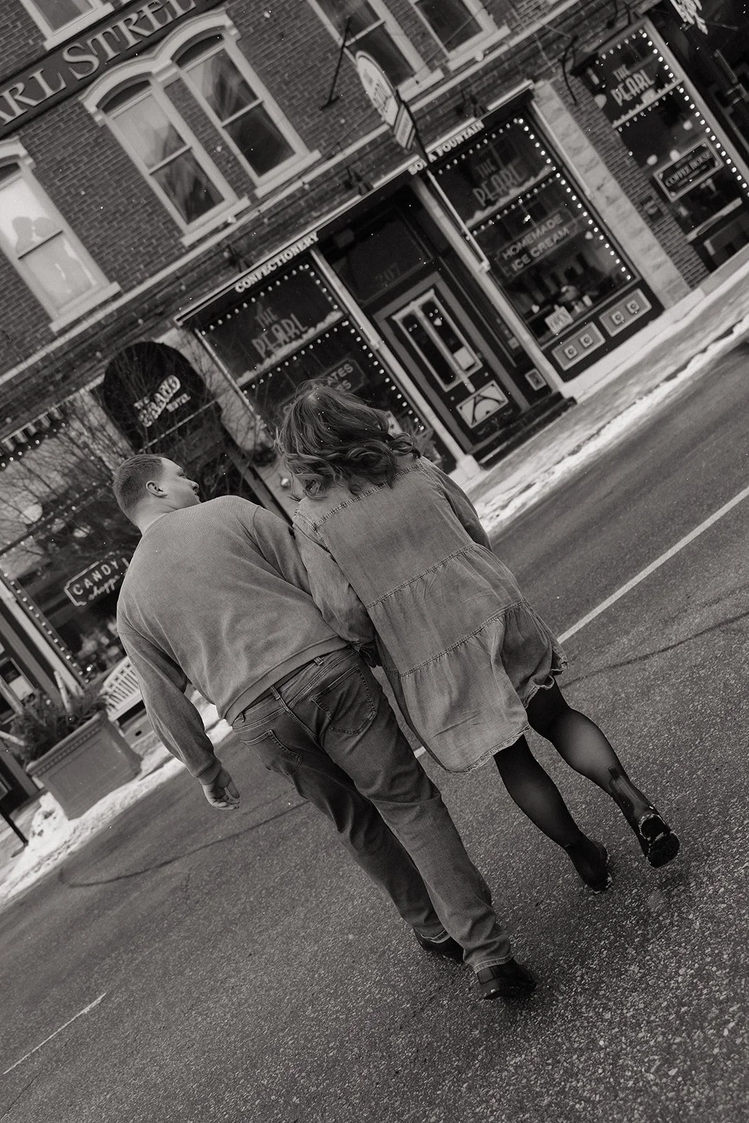 Candid downtown engagement photos in La Crosse Wisconsin