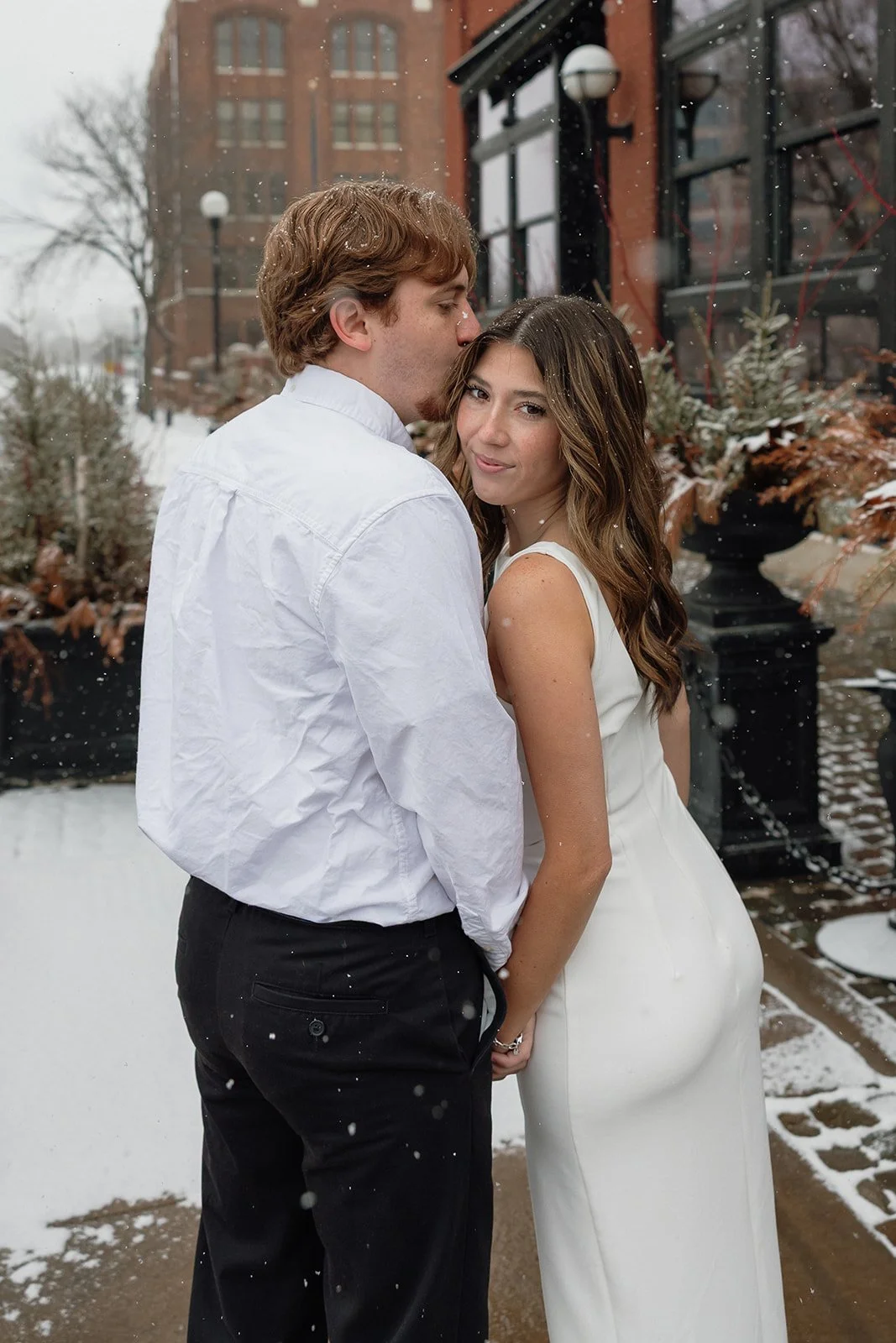 Snowy downtown engagement photos in La Crosse Wisconsin