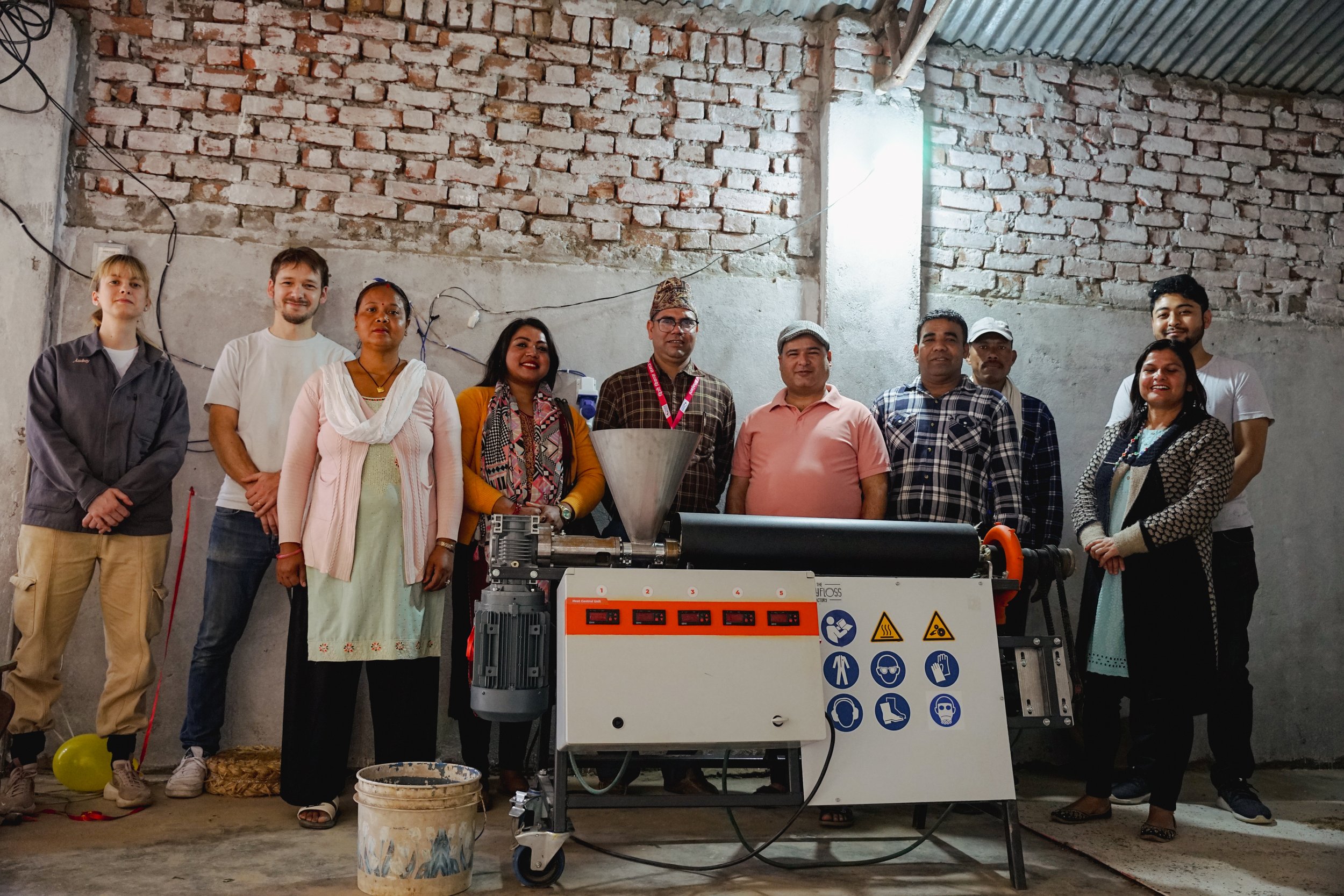 PIPER Project, local team and local maire advisor with the machine, The Polyfloss Factory, World Vision International Nepal and the Response Innovation Lab, Nepal, 2024. Credits: The Polyfloss Factory.