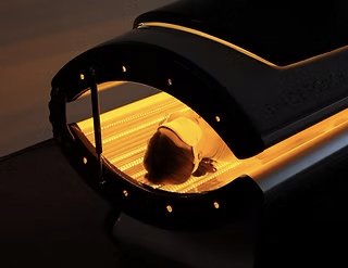 woman doing red light therapy at infinity fitness, a pilates and lagree studio in downtown reno