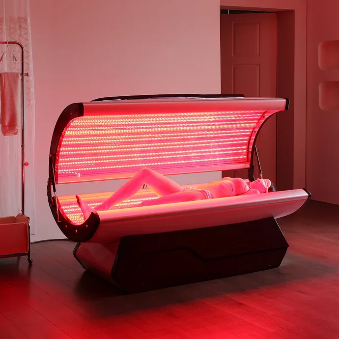woman doing red light therapy at pilates and lagree studio in reno