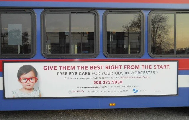 MCPHS Optometry ad on a bus in Worcester
