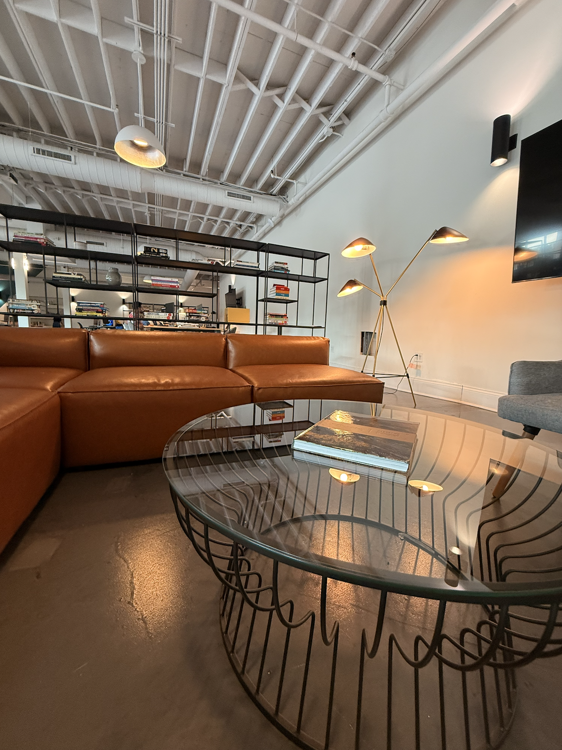 Agency Loft Lounge with Modern Leather Sectional and Glass Coffee Table