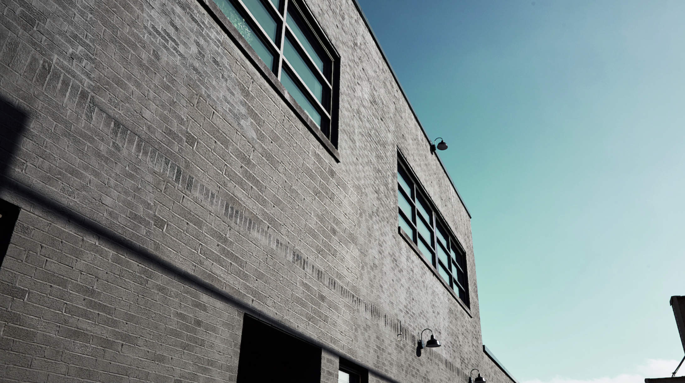 Industrial brick building exterior, Chicago Kinzie Corridor — site of Agency Loft renovation