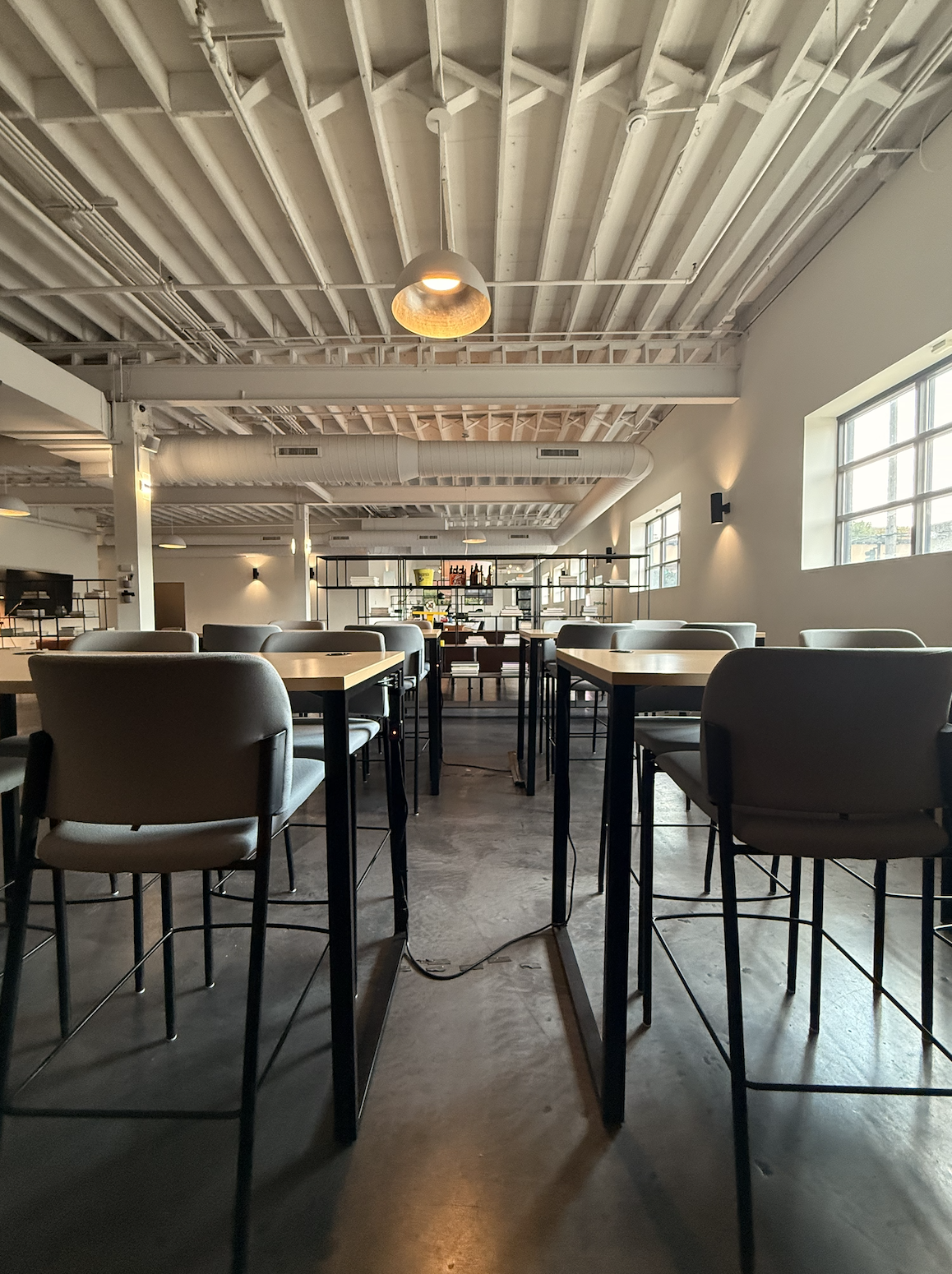 Agency Loft Workspace with High Tables, Industrial Ceilings, and Natural Light