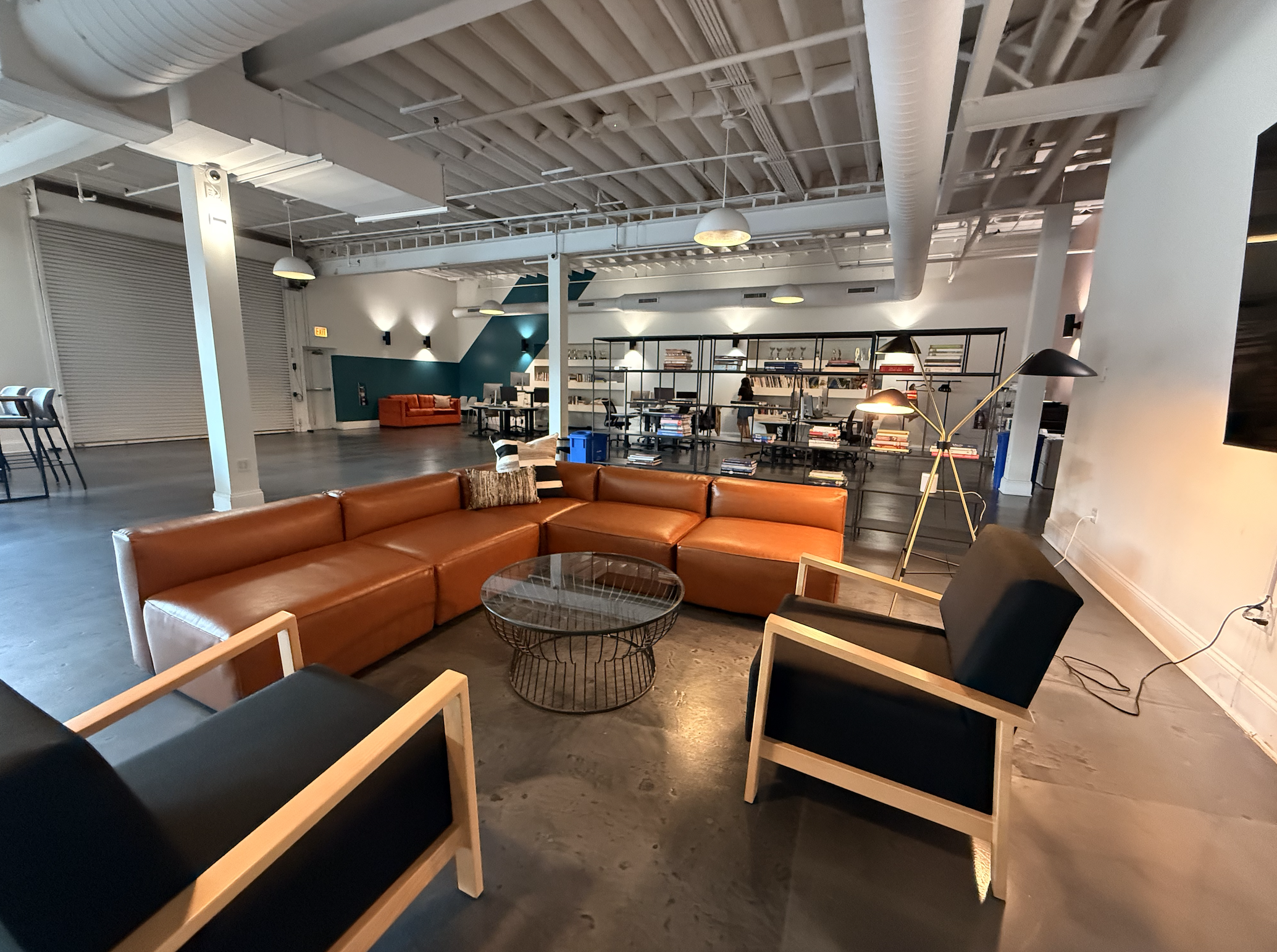 Chicago Agency Loft Lounge with Modern Leather Sectional and Open Workspace Design
