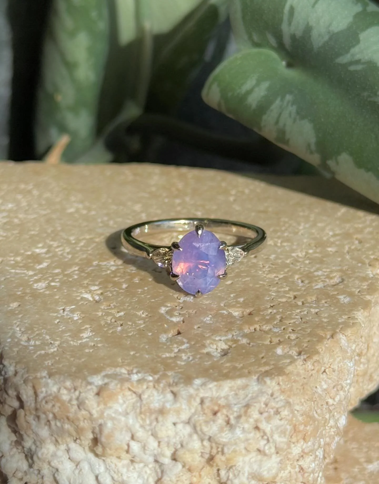 Fall 2025 sneak peek 👀 | 1.97ct opalescent purple sapphire flanked by a pair of Canadian pear shaped diamonds