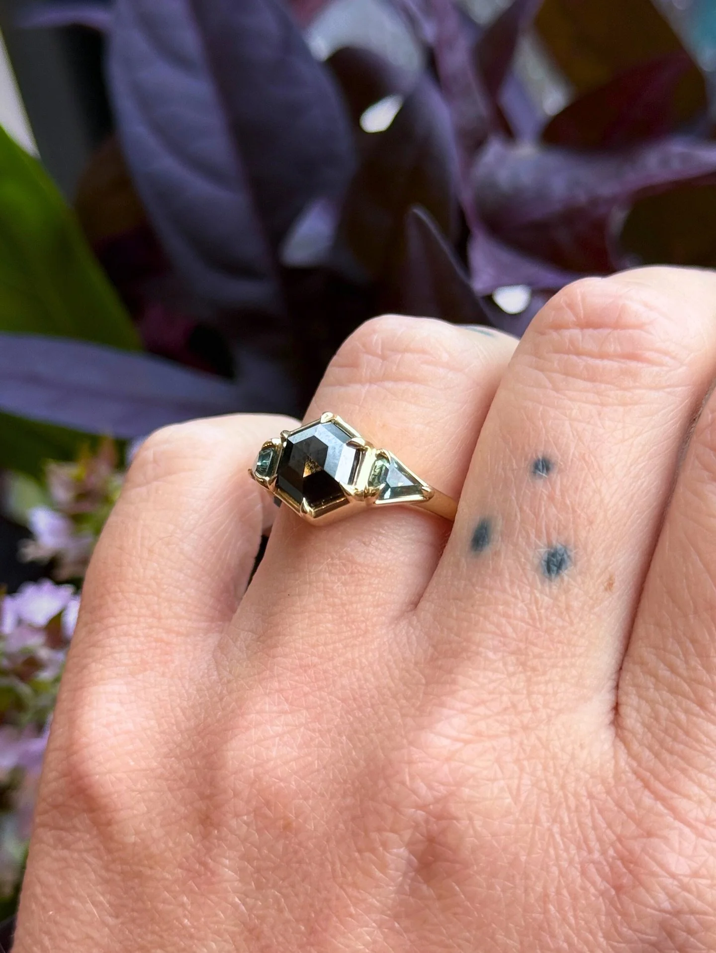 QUINN 🖤 one of our favorite designs is hitting the shop with an unreal color combination a rose cut black diamond flanked by Montana sapphires | THIS THURSDAY at 630pm #misfitsinthewild