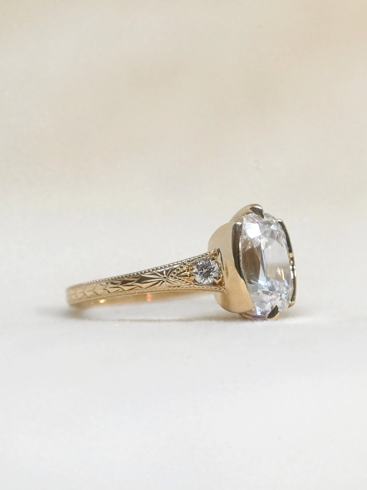 We&rsquo;re going crazy about the new Lydia ring that&rsquo;s hitting the shop this week! This incredible ring has a lab grown 2.33ct Antique style cushion cut center diamond and art deco hand engraving all down the band that&rsquo;s made from 14kt y