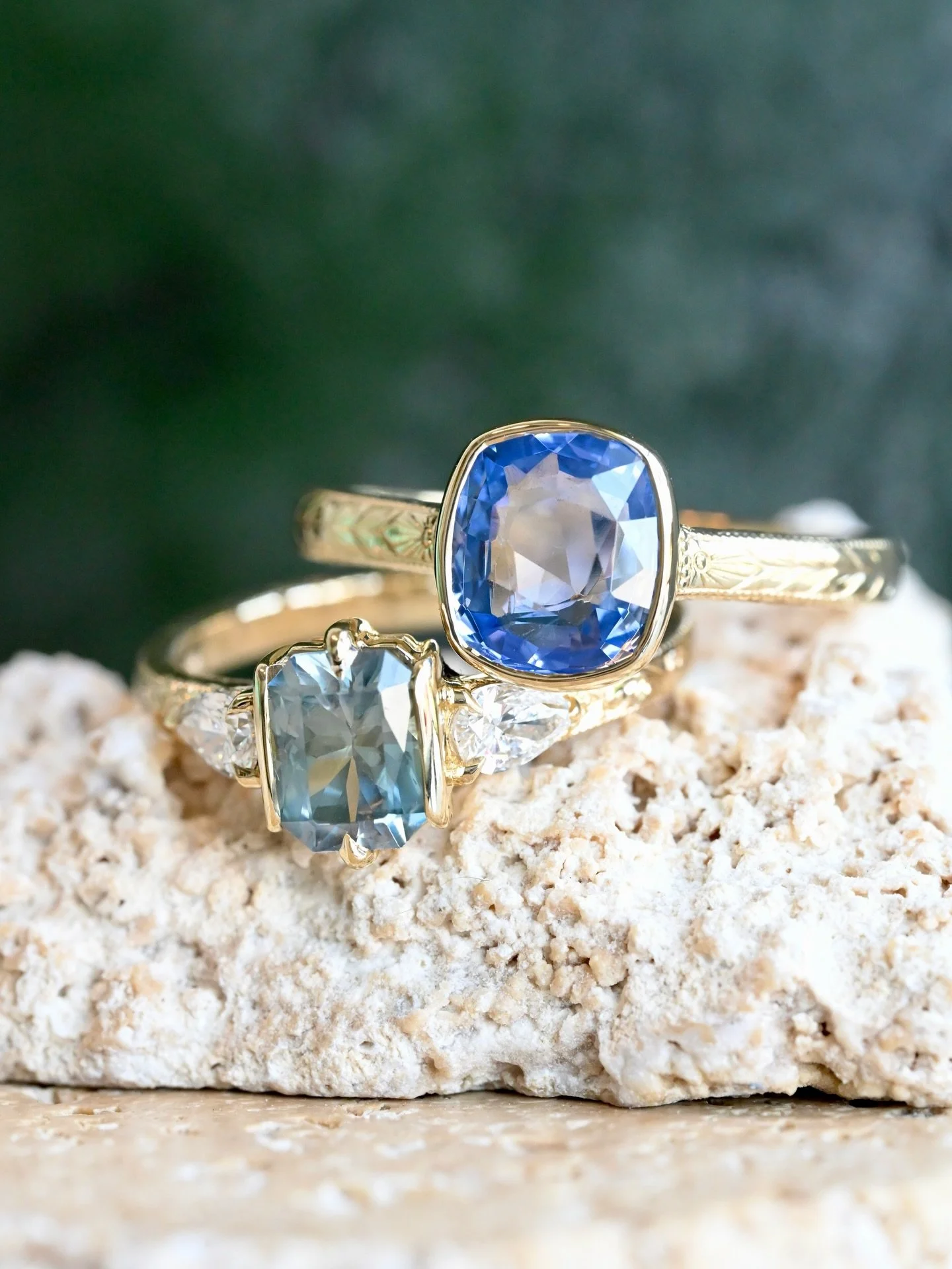 An unbelievable pair of engagement rings for Grace &amp; Claire! They came to us with two heirloom sapphires, (the teal was mined by our client in Montana when she was a kid!!!) the other came from a family bracelet. Both designed in 14kt yellow gold