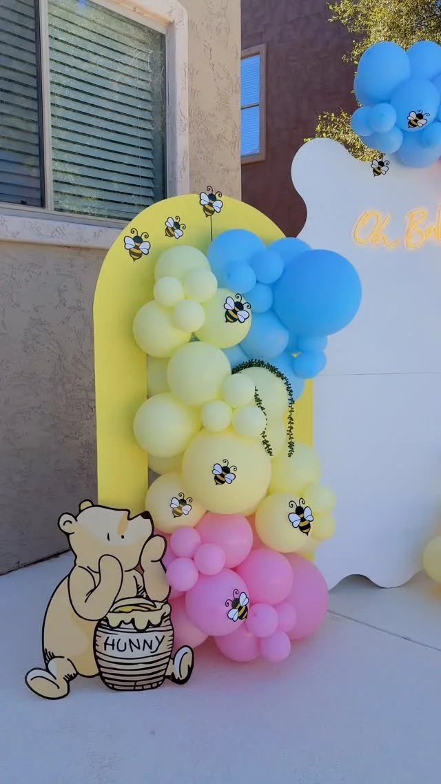 🍯🐝 Sweet as hunny, and twice as magical! 🐝🍯
This Winnie the Pooh–inspired gender reveal came to life with soft pastel balloons in yellow, blue, and pink, playful little bees, and our LED “Oh Baby” neon sign. We loved adding the