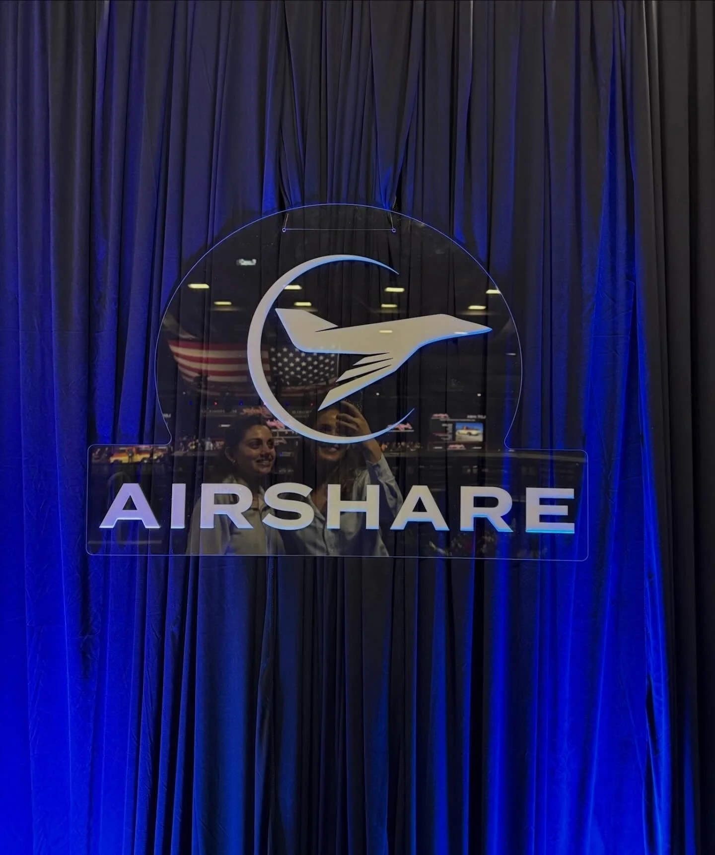 We created this setup for Airshare during Barrett-Jackson at WestWorld of Scottsdale, and the background bidding noise is there on purpose. That energy was unreal and we wanted to capture it exactly as it felt in the room.

Custom blue draping, brand