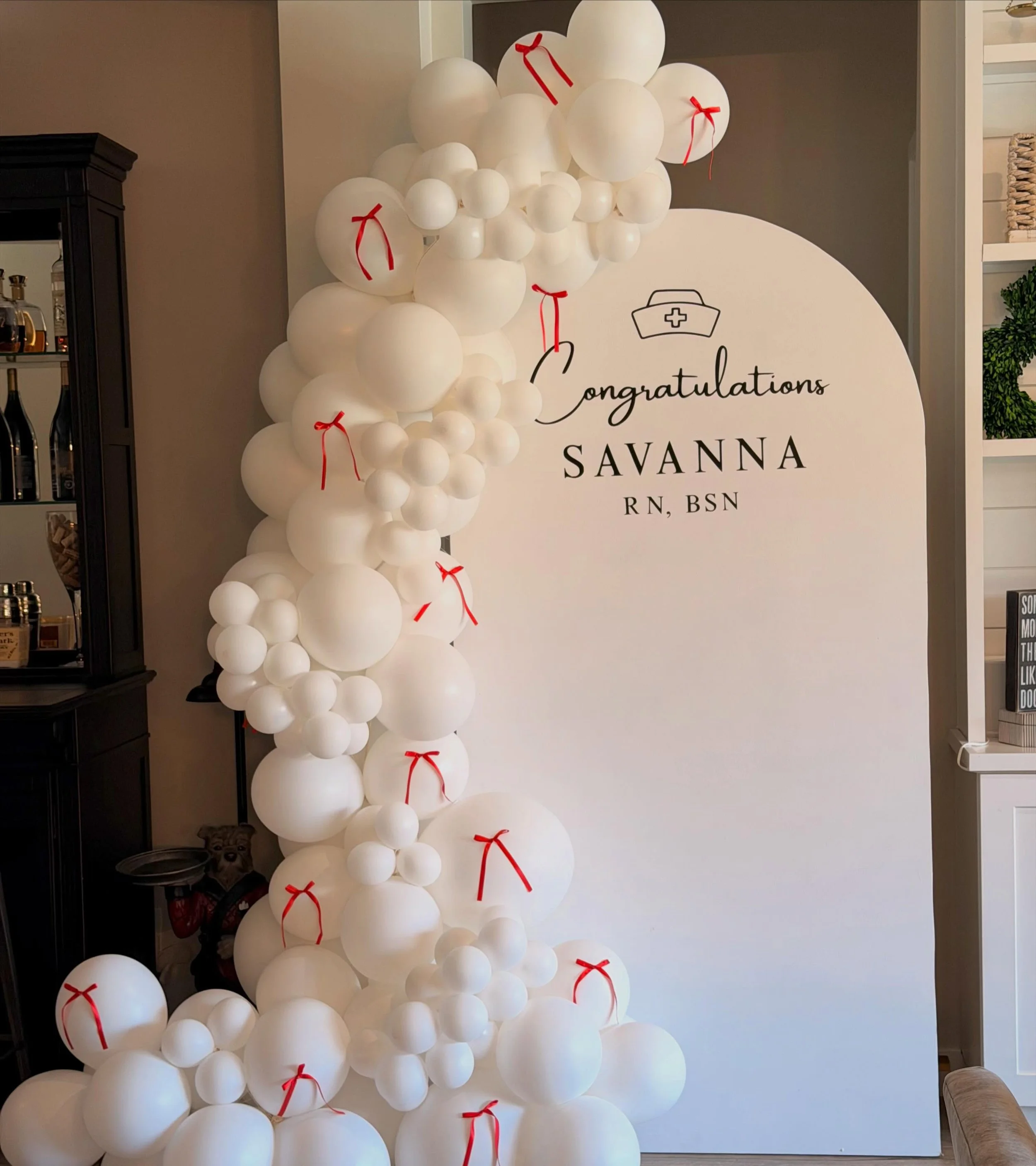 A huge congratulations to Savanna RN, BSN 🤍🩺
Simple, clean, and custom just the way we love it. This nursing graduation backdrop featured hand-tied &ldquo;scrub cap&rdquo; balloons for the sweetest personalized touch. Perfect for graduation parties