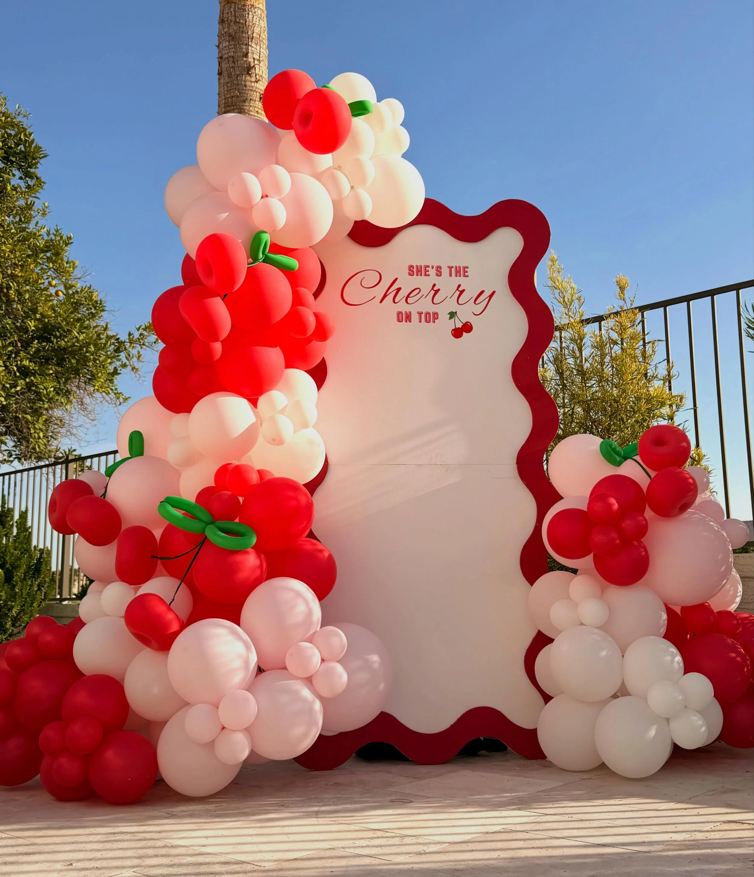 🍒 She&rsquo;s the Cherry on Top! 🍒

This custom Cherry on Top birthday party backdrop was designed to create the perfect statement photo moment. Featuring an organic balloon installation in red, blush, pink, and white with oversized cherry balloons