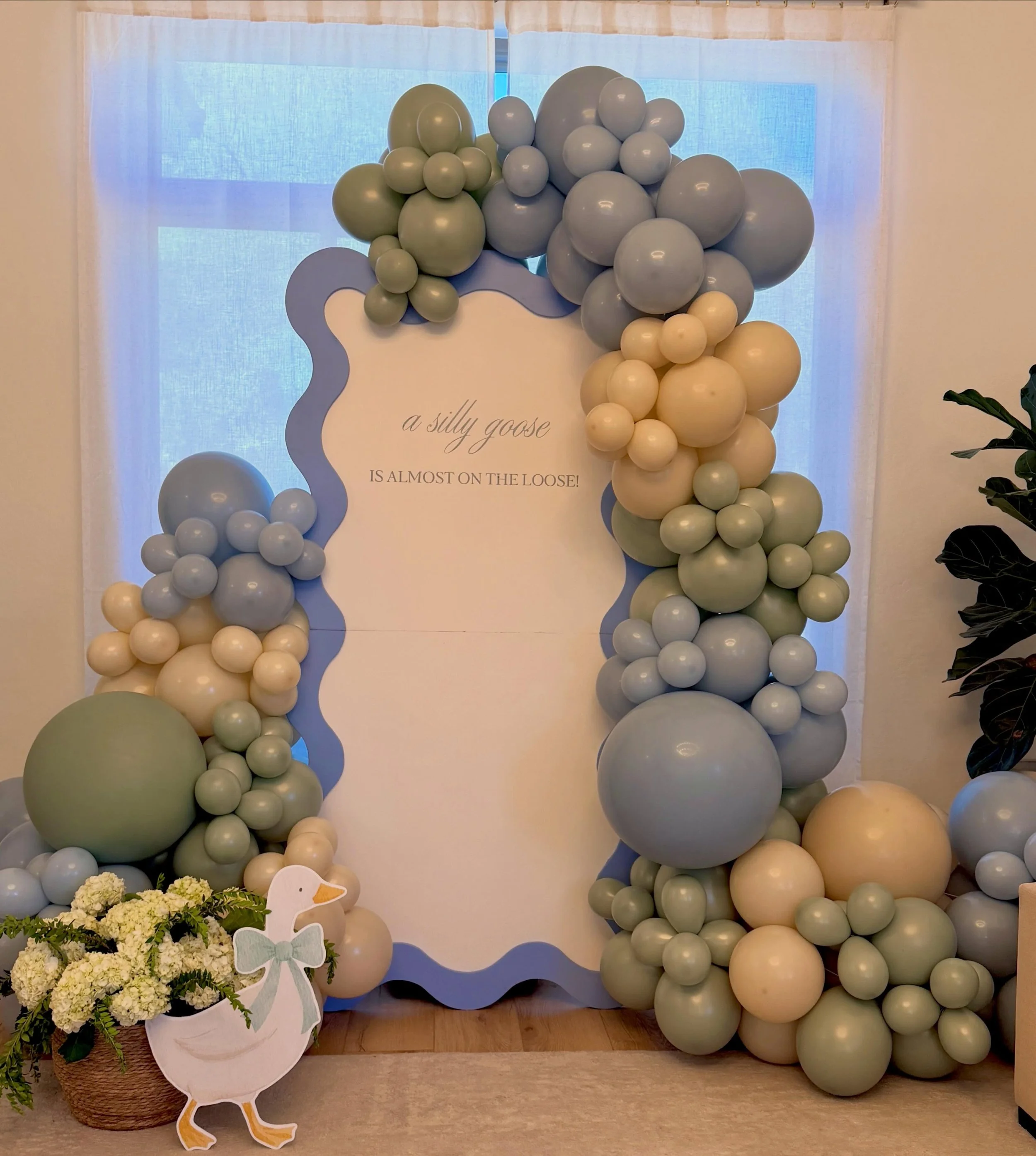 A silly goose is almost on the loose. 🪿🩵

Soft blues, creamy neutrals, and playful details came together to create the sweetest baby shower backdrop. Every balloon, every curve, and every little detail was designed to celebrate this special season 