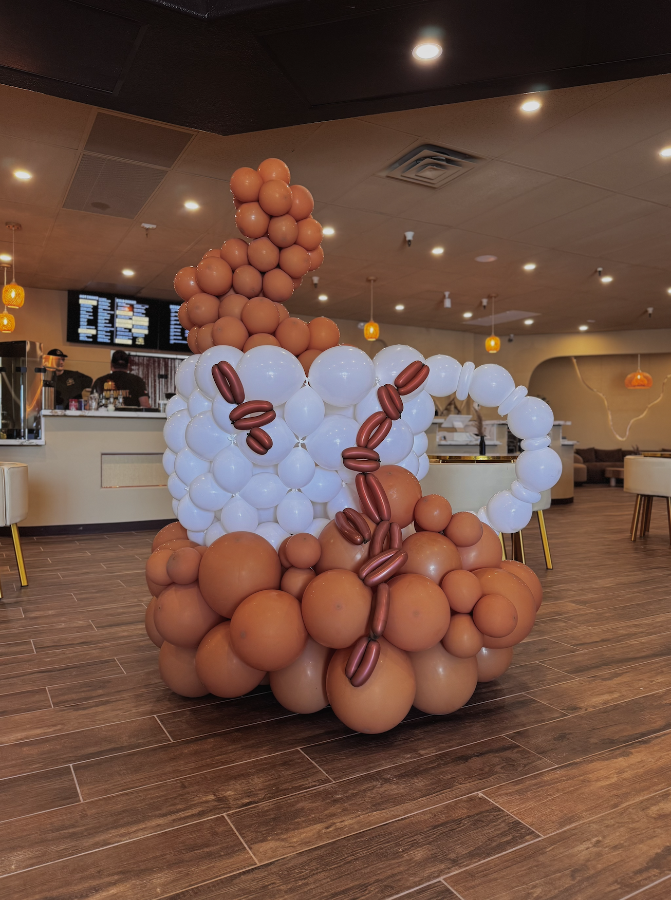 Custom coffee mug balloon structure created for a coffee shop grand opening balloons