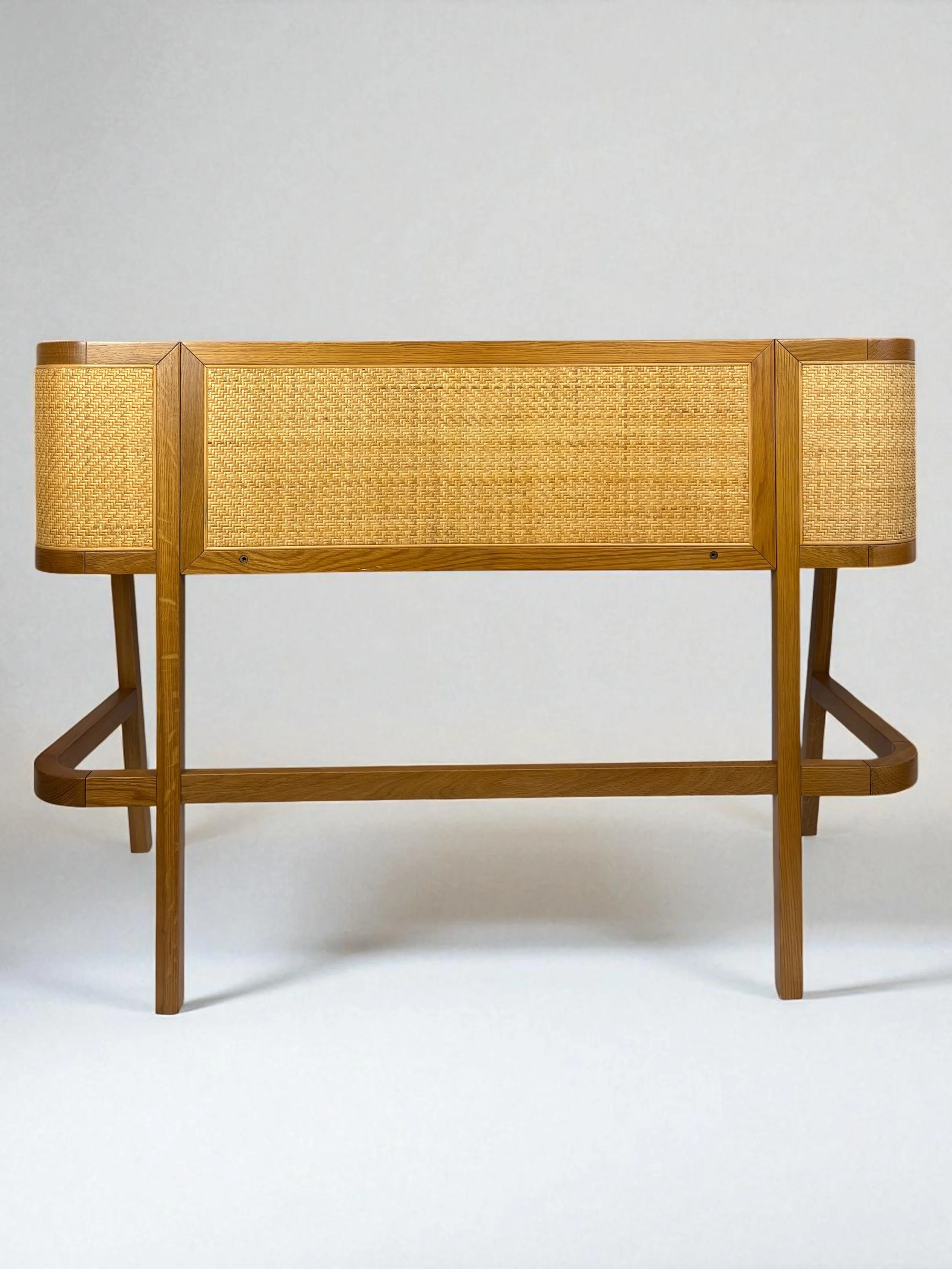 Solid oak, rubber wood and natural rattan desk with cord hider and brass hardware, pre-owned