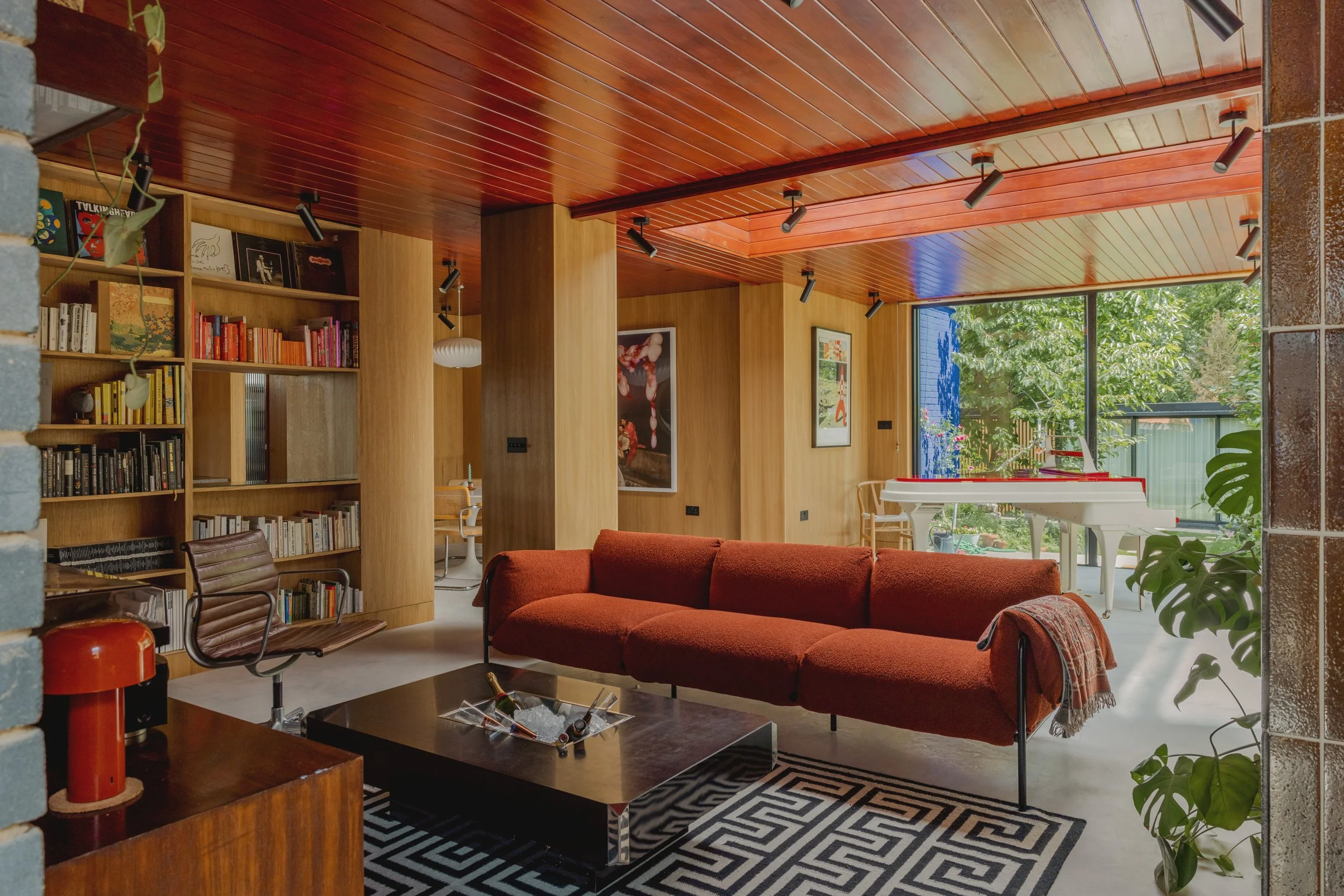 Retro House - photoshoot and film location. 1960’s Mid-Century build brought into the modern era with a faithful restoration of timber clad ceilings and walls and modernist furniture that showcases the original architecture throughout. 