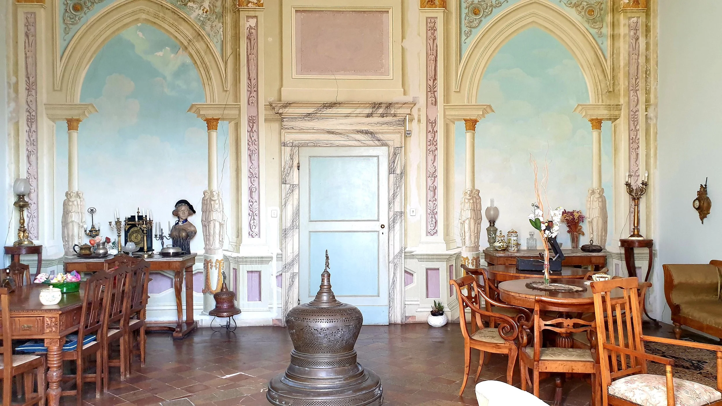 Mastrangelo - Marche, Italy - Palazzo Photoshoot and film location, beautiful gardens and colonnades with yellow wall backdrops. Pastel frescoes adorn the interiors which have sweeping views across the landscape.