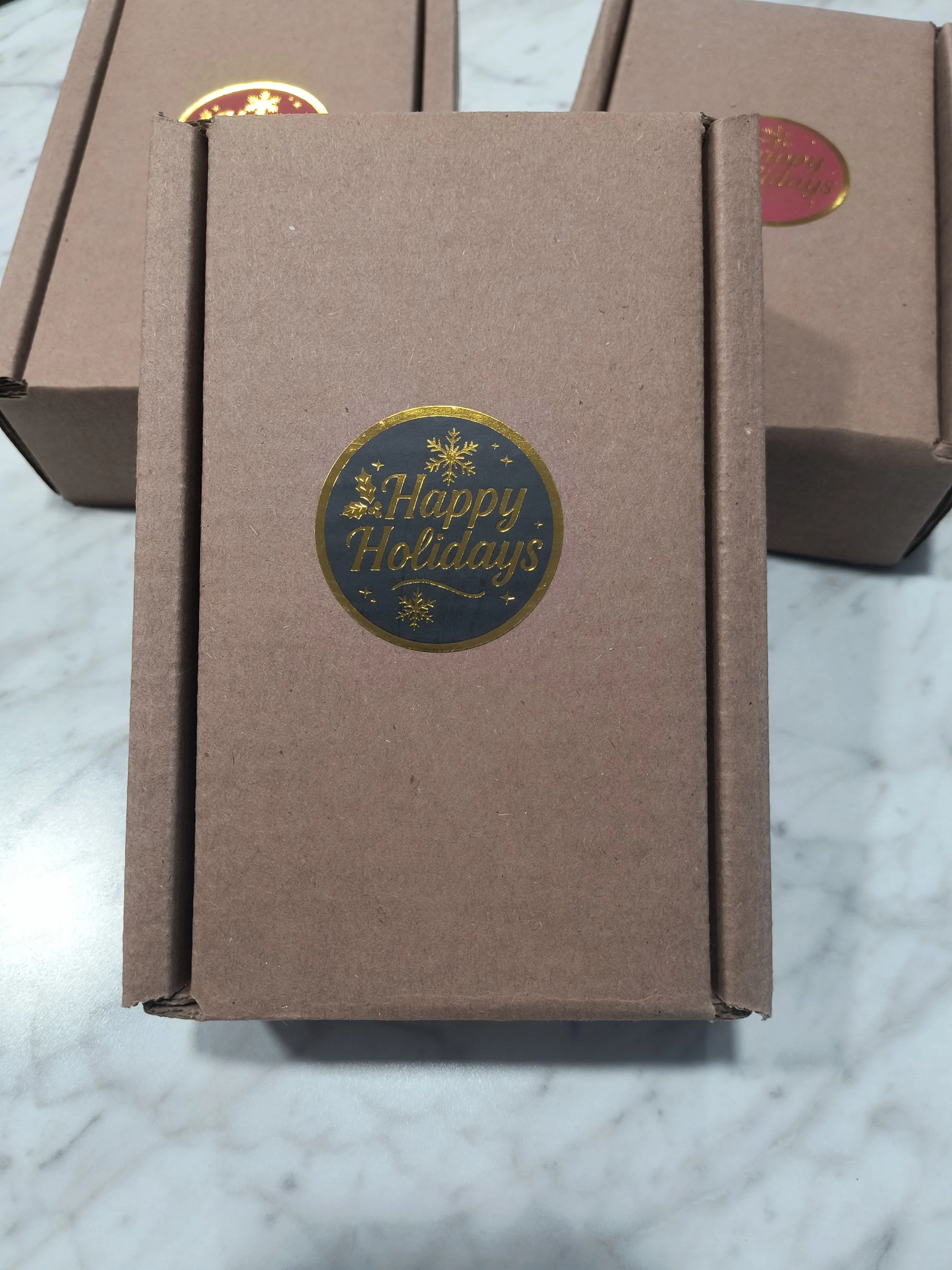 2 pack box outside w holiday sticker.jpg