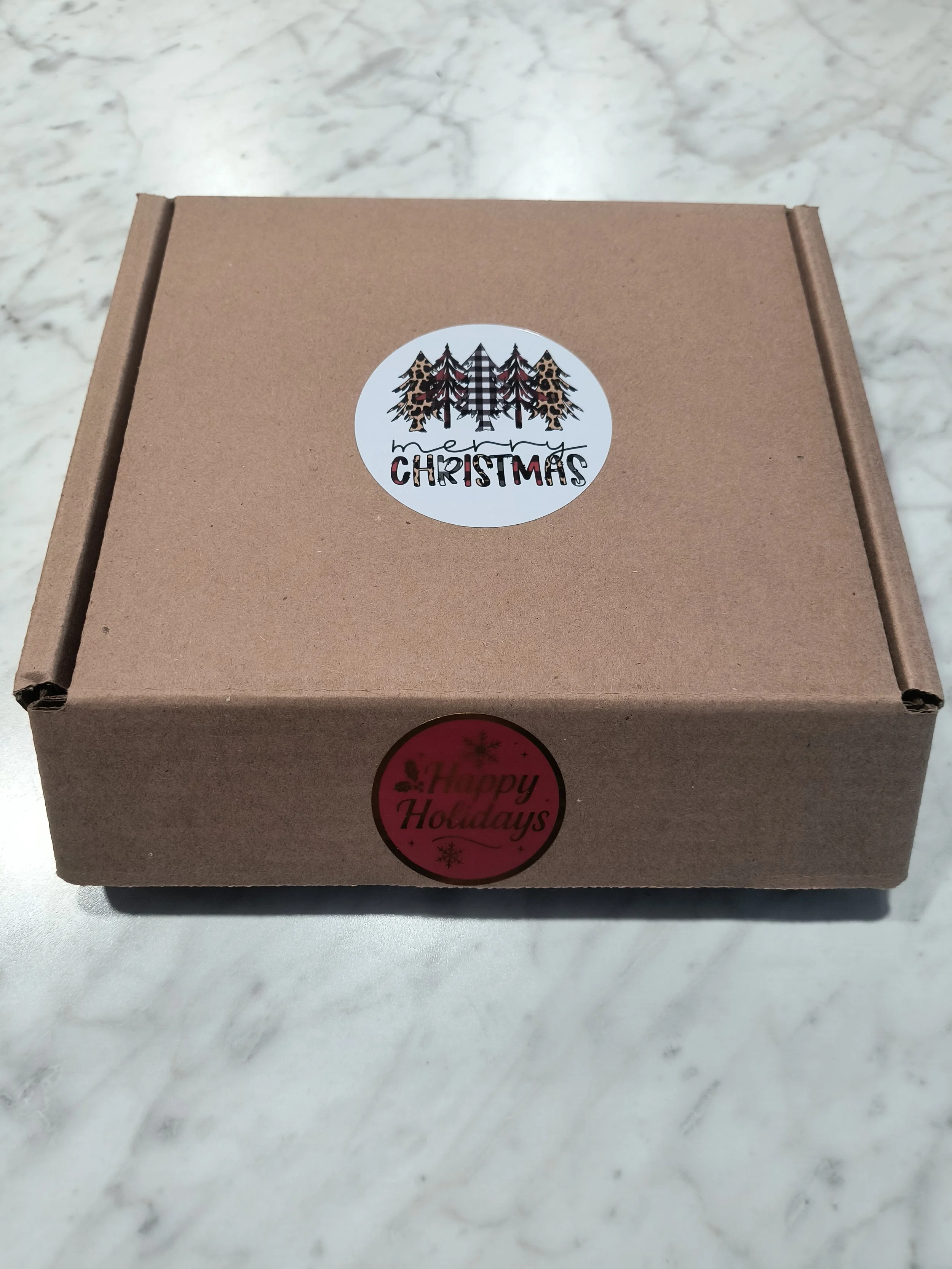 4 pack box outside with holiday stickers.jpg